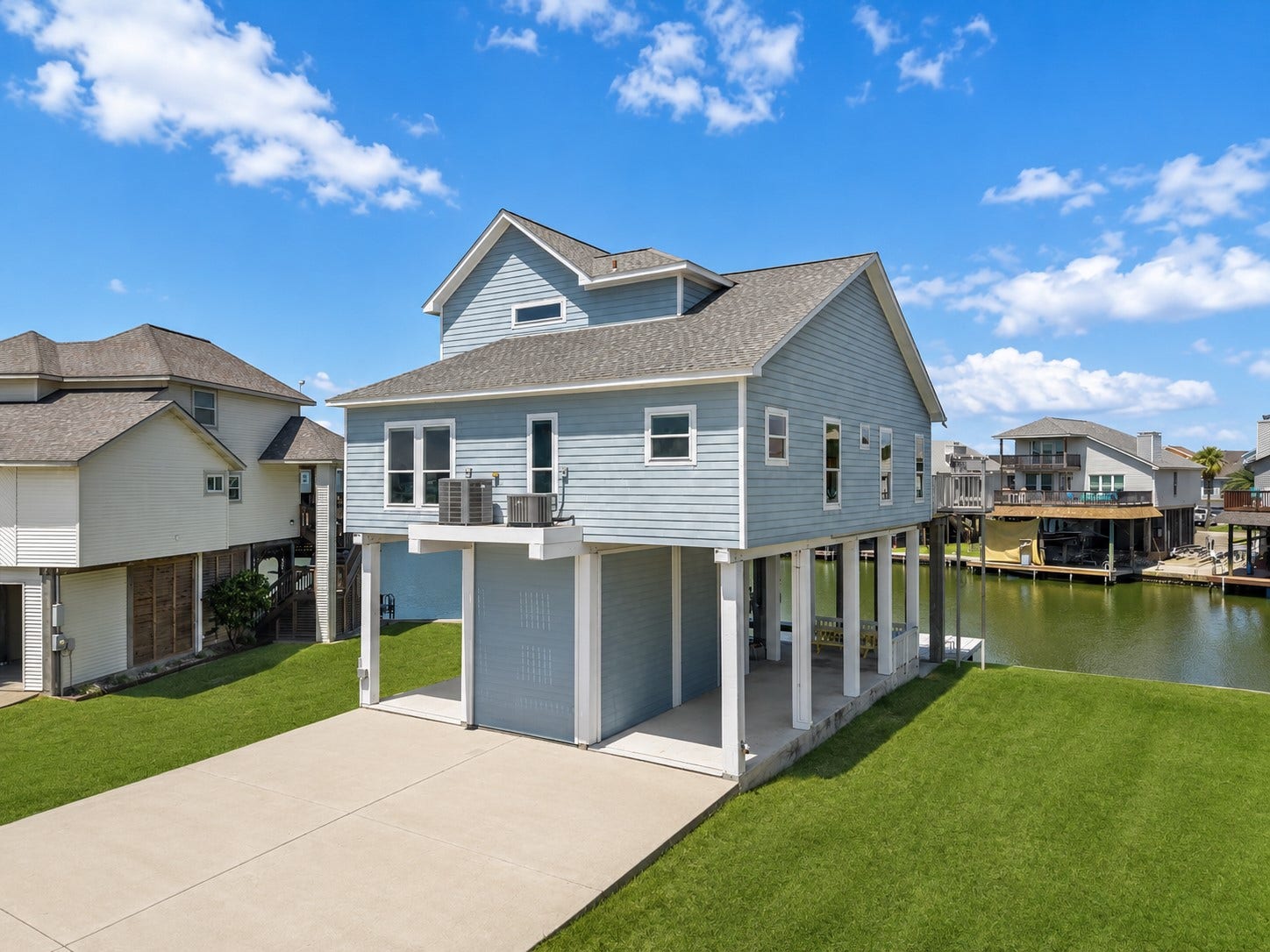 314 Windward Way, Tiki Island, TX 77554 Experience elevated waterfront living in Tiki Island! This immaculately maintained coastal retreat welcomes you