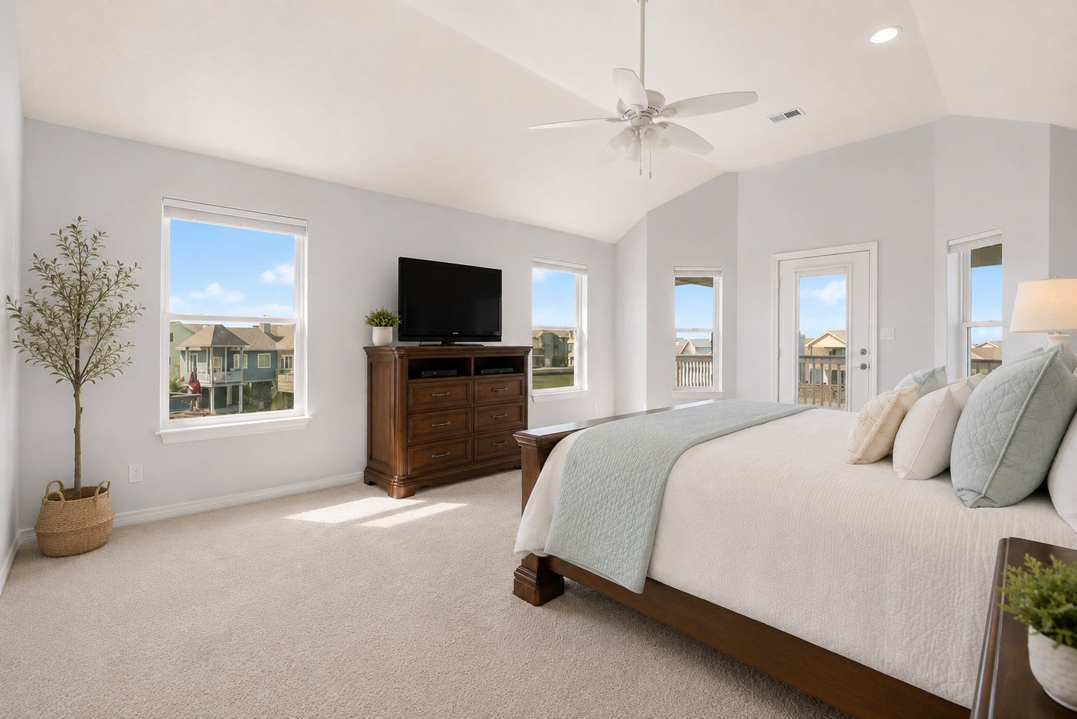 314 Windward Way, Tiki Island, TX 77554 On the second floor, the private primary retreat offers its own waterfront balcony and spa-inspired en-suite with soaking tub, walk-in shower, dual sinks, and walk-in closet.