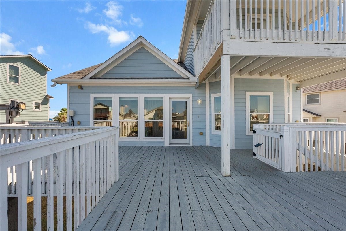 314 Windward Way, Tiki Island, TX 77554 Enjoy an expansive deck, private boathouse, covered parking beneath the home, additional garage space, and exceptional outdoor livingall just a short walk from the neighborhood park.