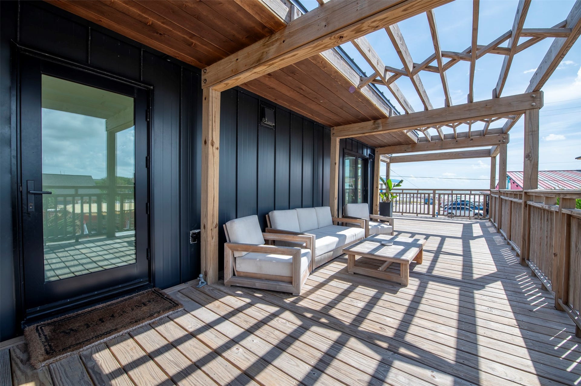 2906 Avenue R 1/2, Galveston, TX 77550 Front house 600+ sq ft deck with gulf views, pergola, and seating.
