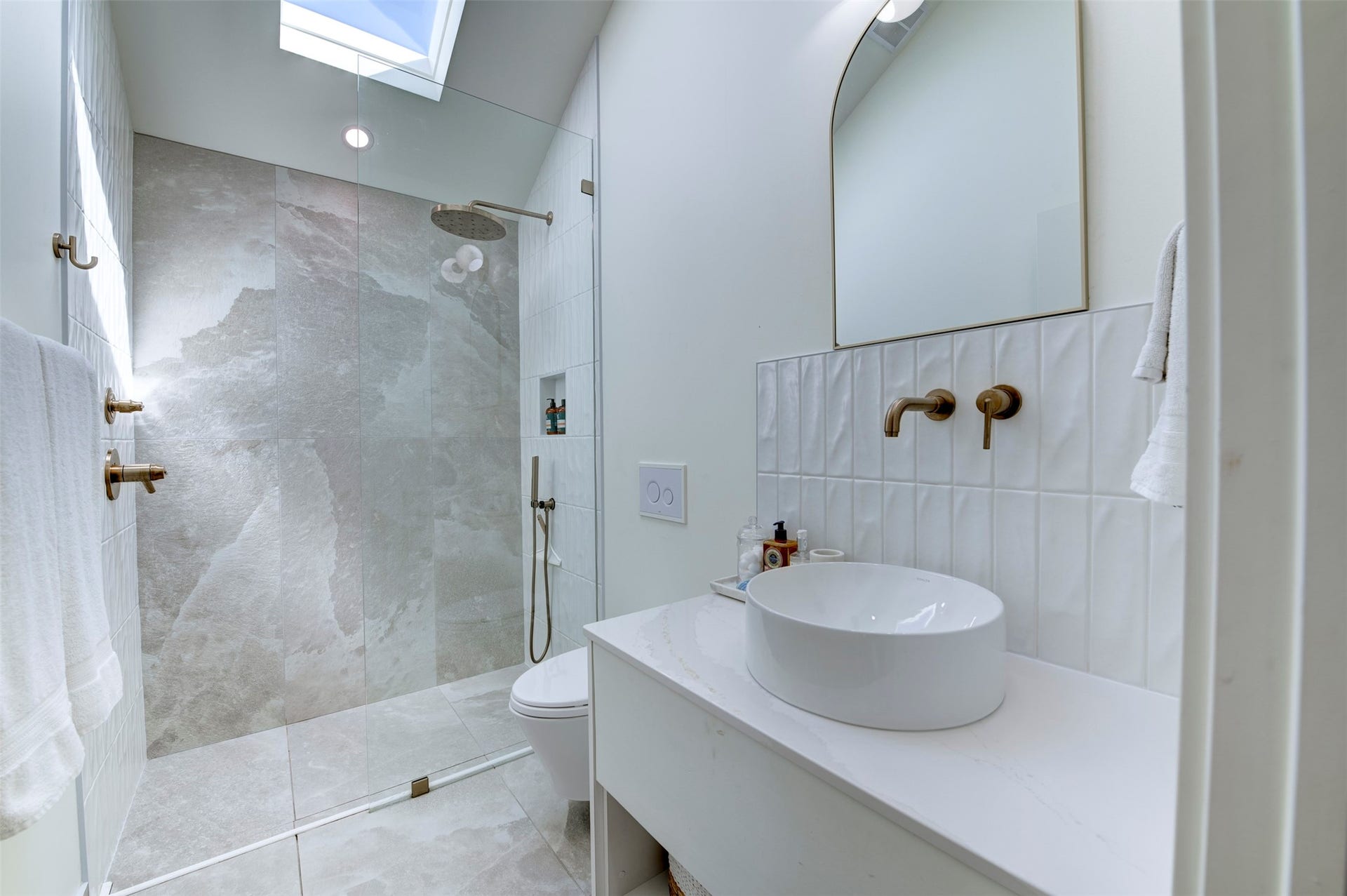 2906 Avenue R 1/2, Galveston, TX 77550 Back house bathroom with a skylight, a walk-in glass shower and a vessel sink.