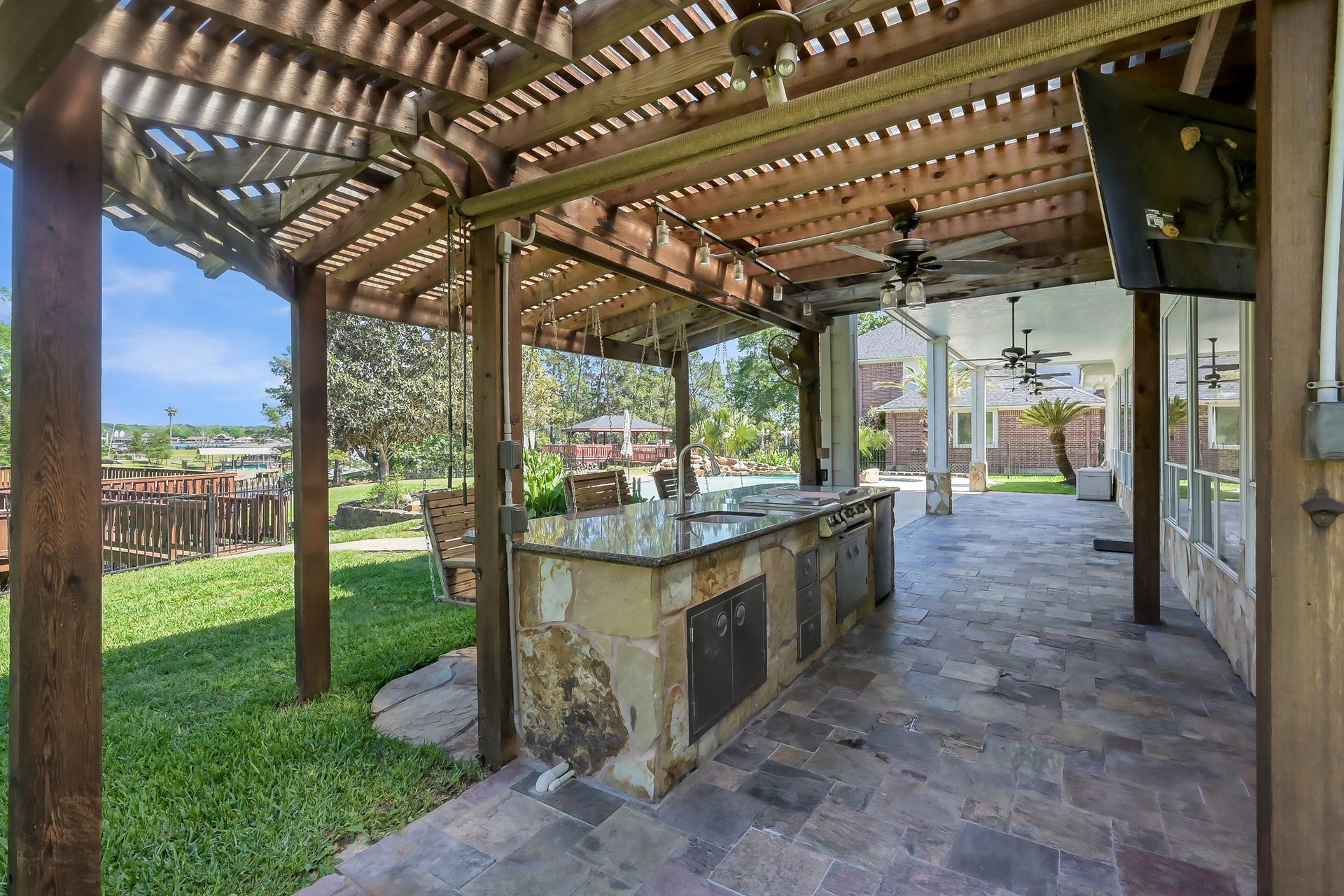 12758 Aries Loop Loop, Willis, TX 77318 View of the Large Patio and Outdoor Kitchen
