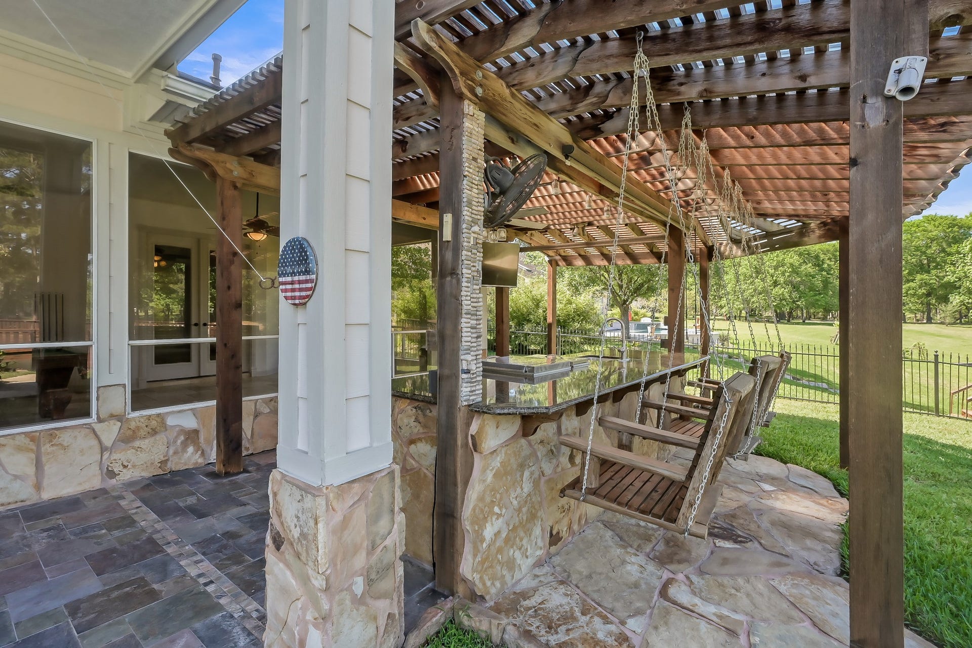 12758 Aries Loop Loop, Willis, TX 77318 Swing seating along the Outdoor Kitchen Bar