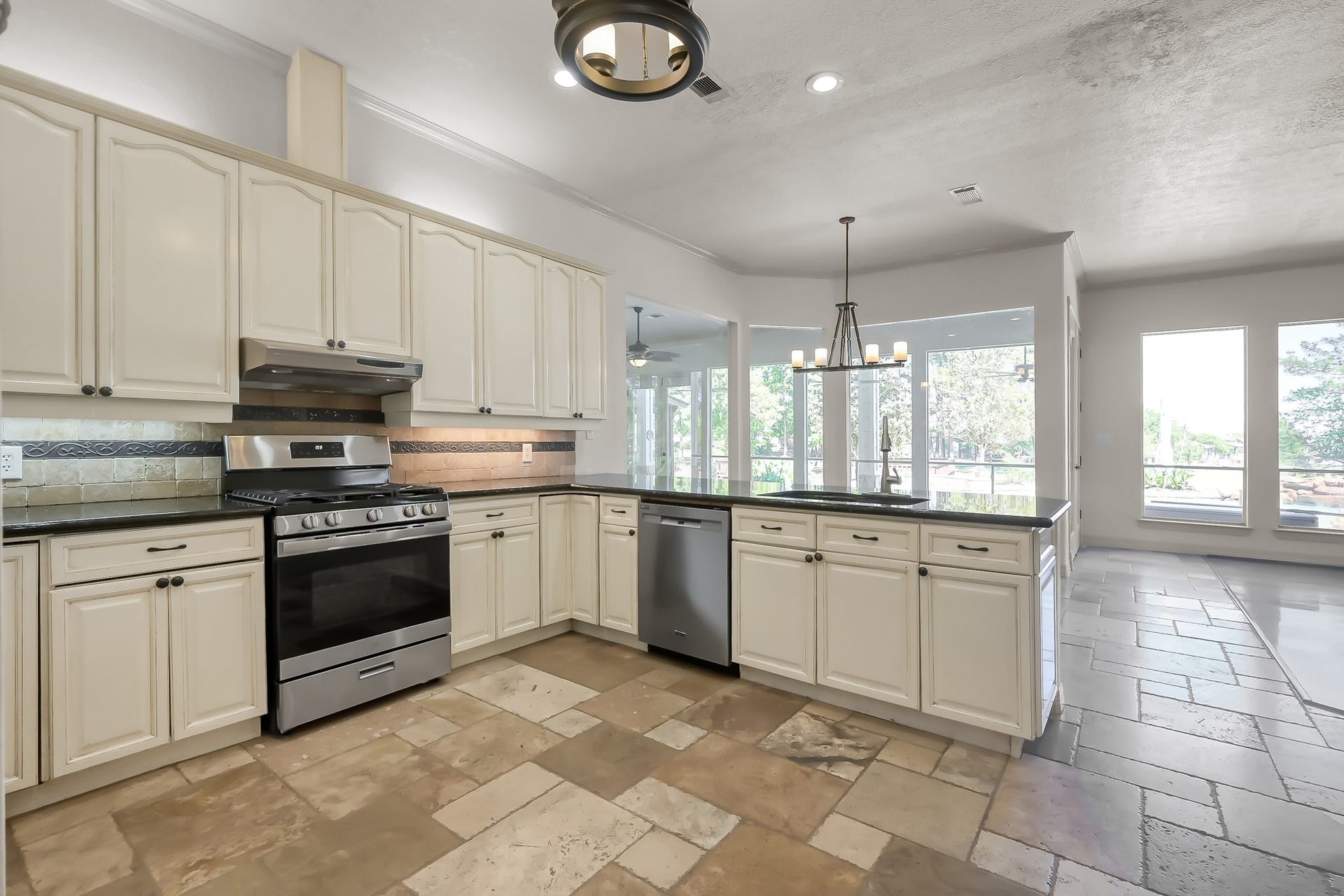 12758 Aries Loop Loop, Willis, TX 77318 Kitchen has Over and Under Cabinet Lighting, Stainless Steel Appliances and Beautiful tile Flooring
