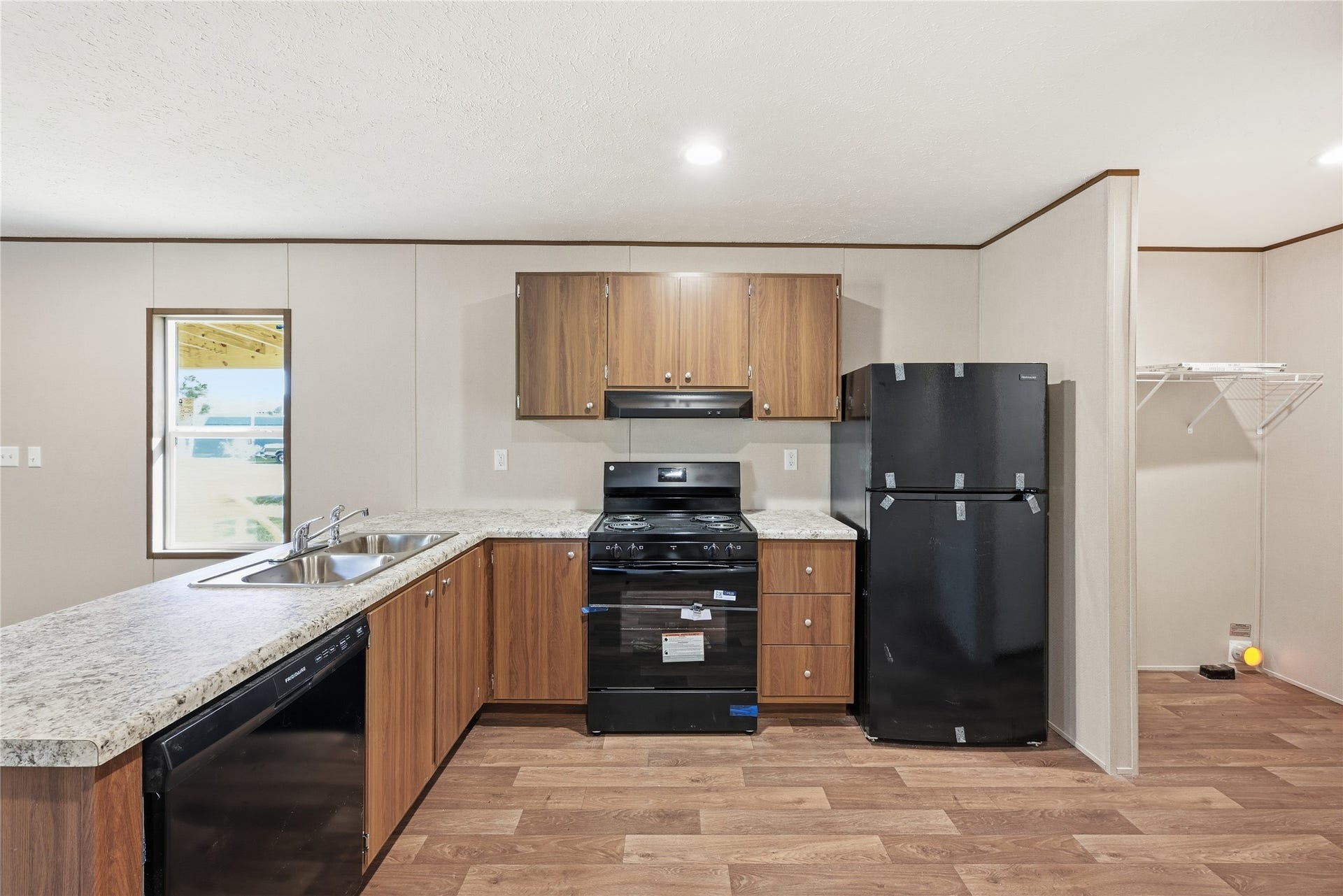 Kitchen with plenty of counter space & NEW ELECTRIC STOVE, REFRIGERATOR & DISHWASHER!