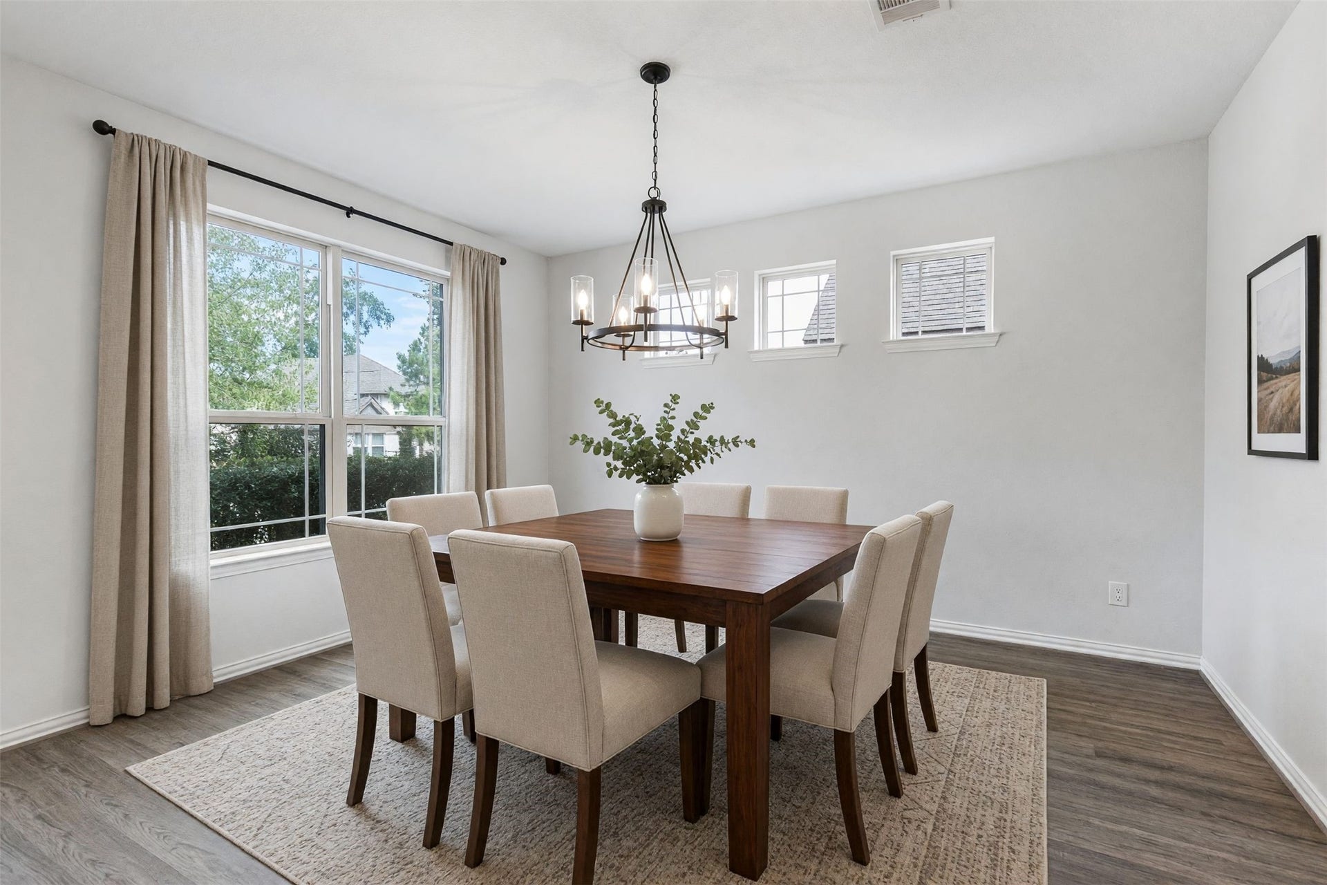 Virtually staged formal dining room.