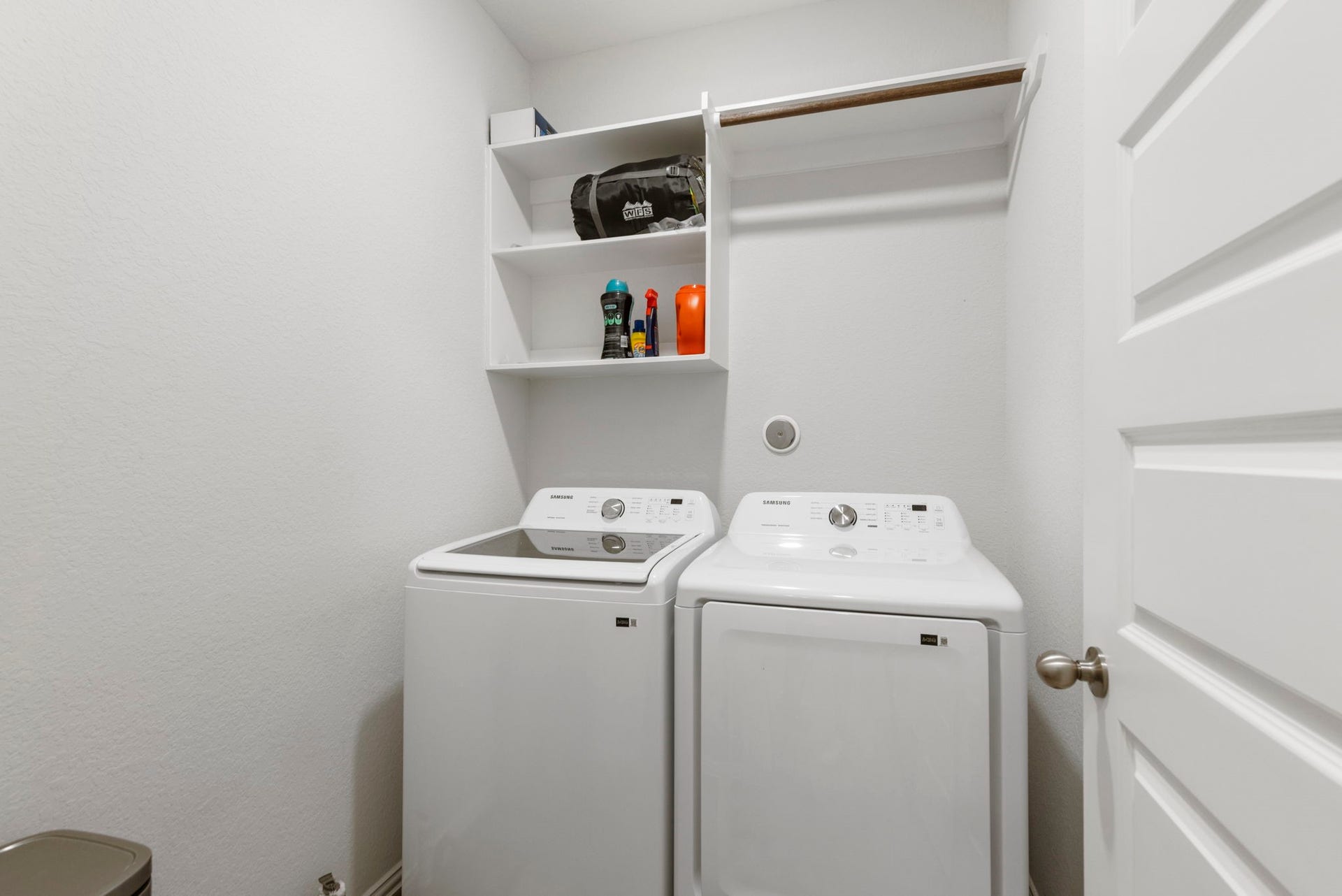 The utility room is equipped with washer and electric dryer connections.
