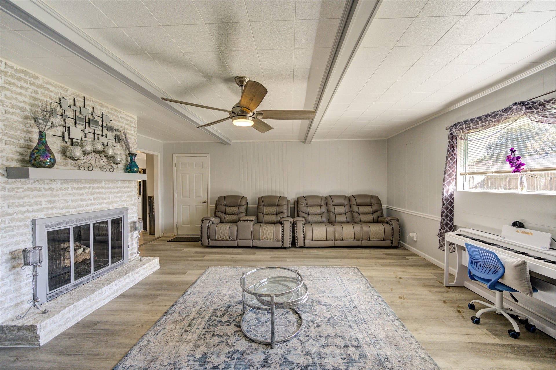 9305 Gettysburg Avenue, Texas City, TX 77591 Another view of the den. The room's neutral tones create a warm and welcoming atmosphere, ideal for relaxation or entertaining.