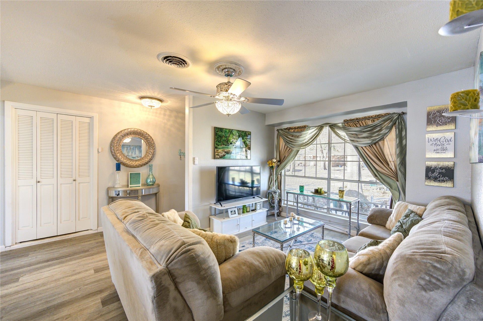 9305 Gettysburg Avenue, Texas City, TX 77591 The living room features a large window and space to entertain or spend time with family while cooking dinner in the kitchen.