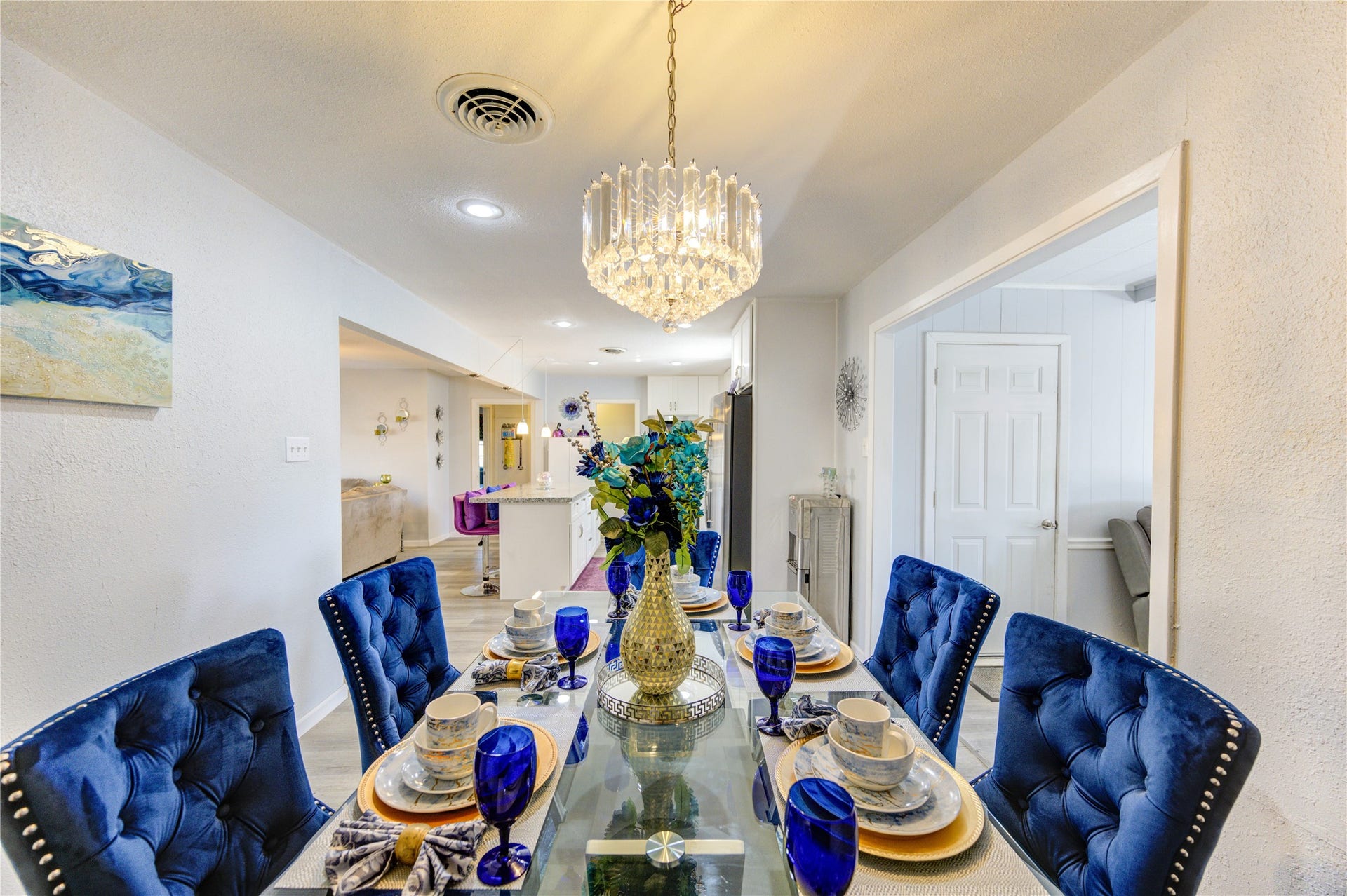 9305 Gettysburg Avenue, Texas City, TX 77591 The dining room features a beautiful chandelier and opens into the bright, modern kitchen just off the den, creating a seamless flow for entertaining.