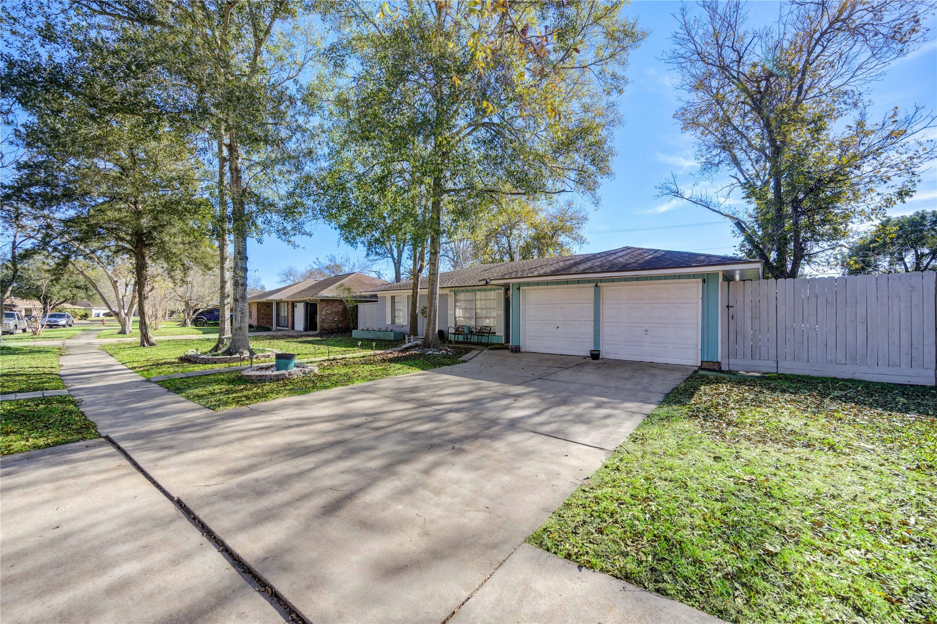 9305 Gettysburg Avenue, Texas City, TX 77591 This home is surrounded by beautiful mature trees and a well-maintained lawn.