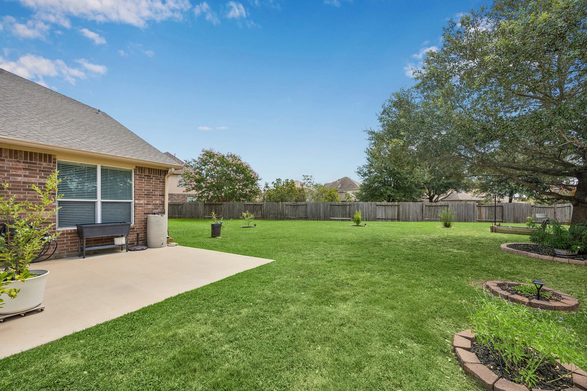 26251 Caper Meadow Lane, Katy, TX 77494 On the other side of the pergola is the extended patio. Lots of space for a grill.