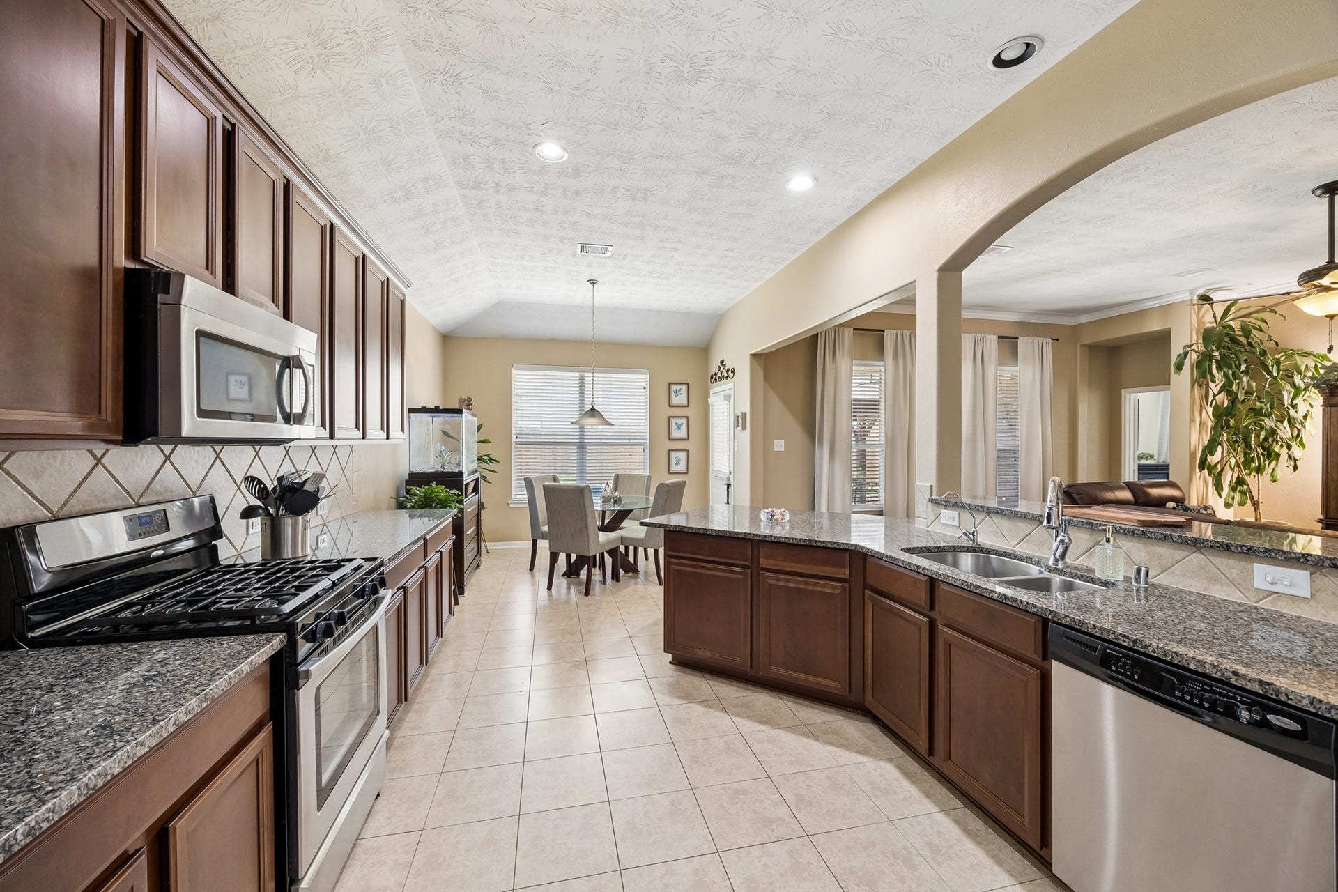 26251 Caper Meadow Lane, Katy, TX 77494 You can enjoy meal prep with the large amount of counter space and the window over the sink totally opens up the room. At the end of the room is a double window and eat in Kitchen area.