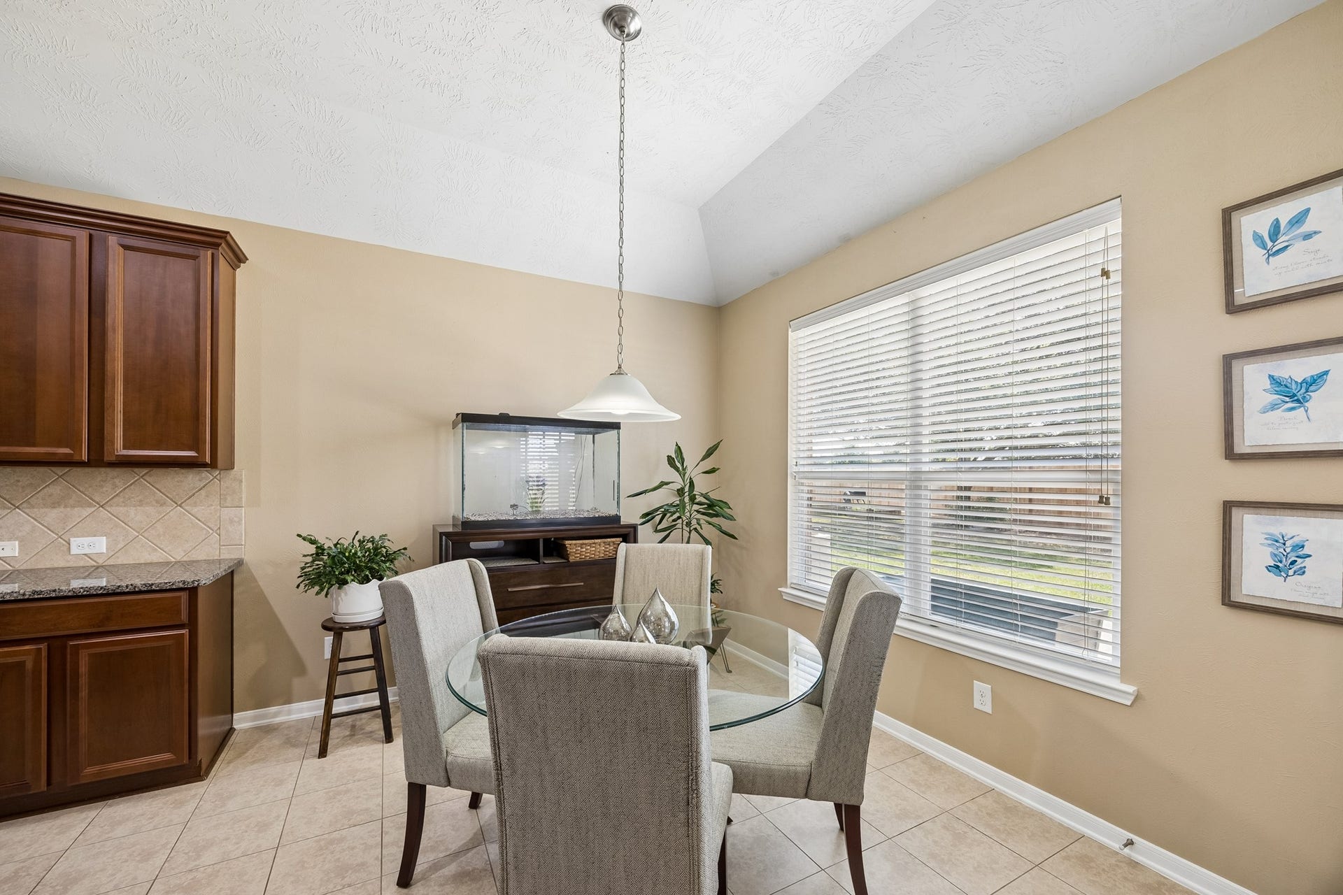 26251 Caper Meadow Lane, Katy, TX 77494 The eat in Kitchen area allows you to have two areas for the family to gather and the tile floors are easy care, especially if you have pets. There is a door that leads to the covered patio area.