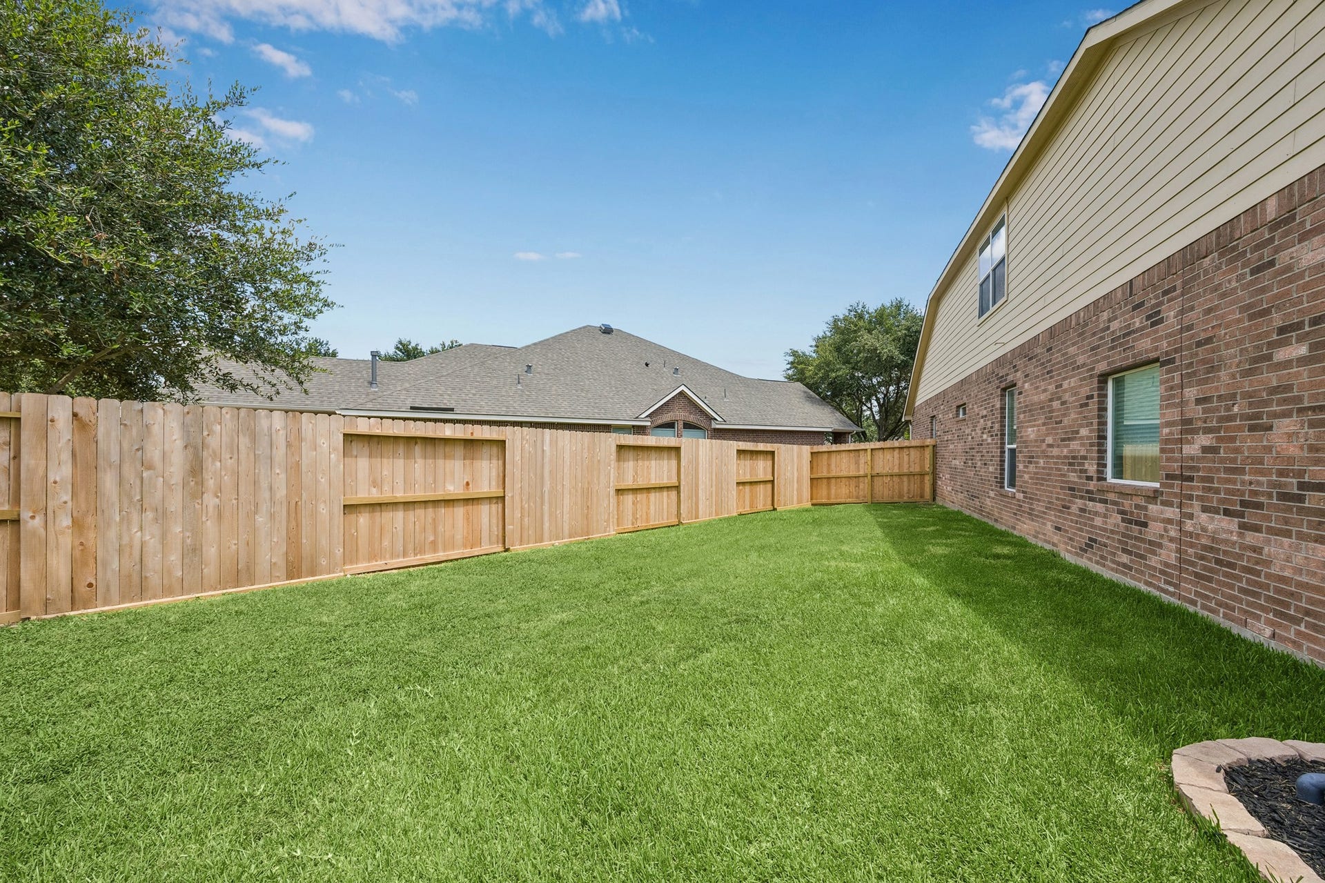 26251 Caper Meadow Lane, Katy, TX 77494 This view shows the smaller side of the large yard with its new fence. The other side of yard is even bigger and private.