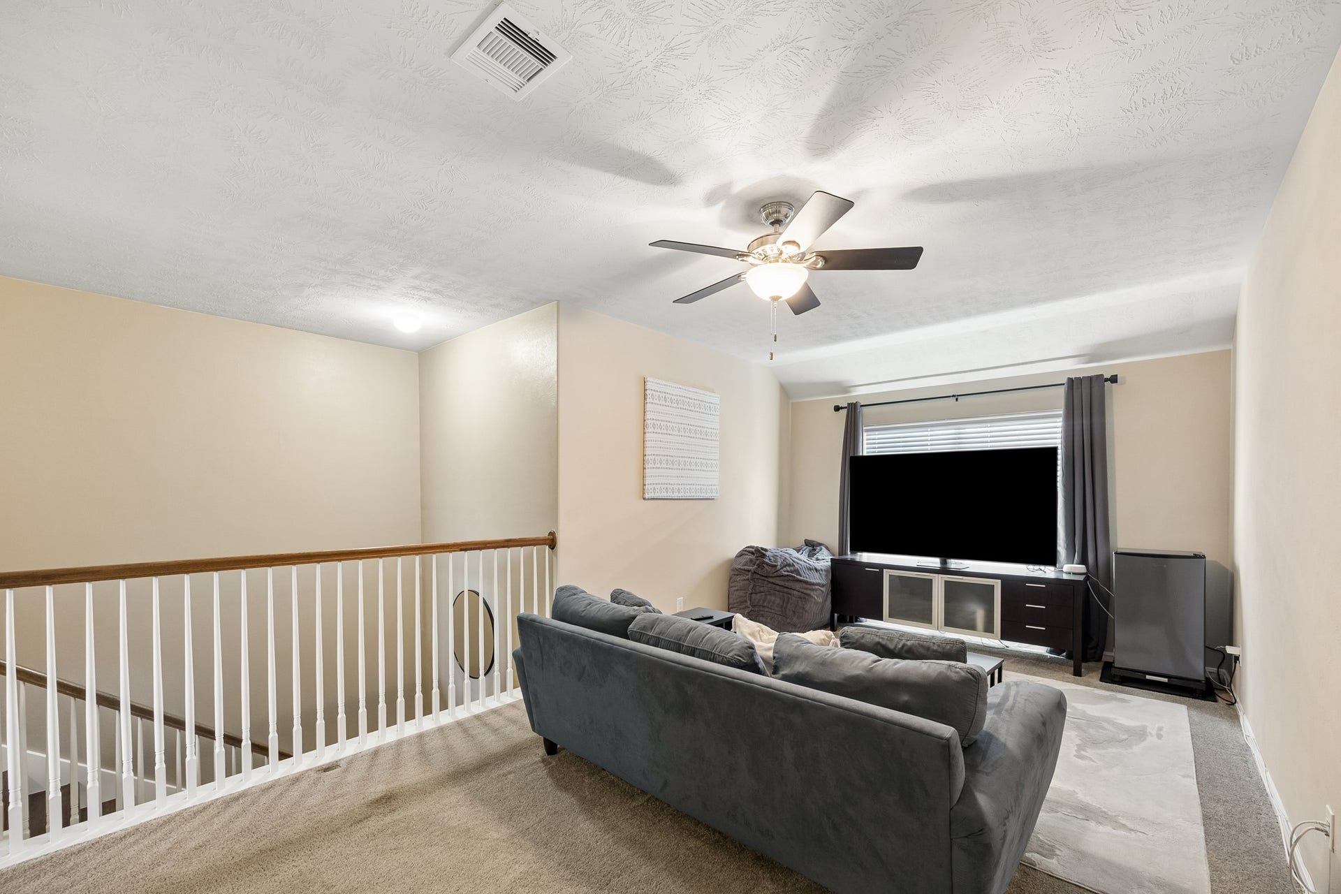 26251 Caper Meadow Lane, Katy, TX 77494 As you go up the stairs, with no carpet, is the Game Room for an extra living space.