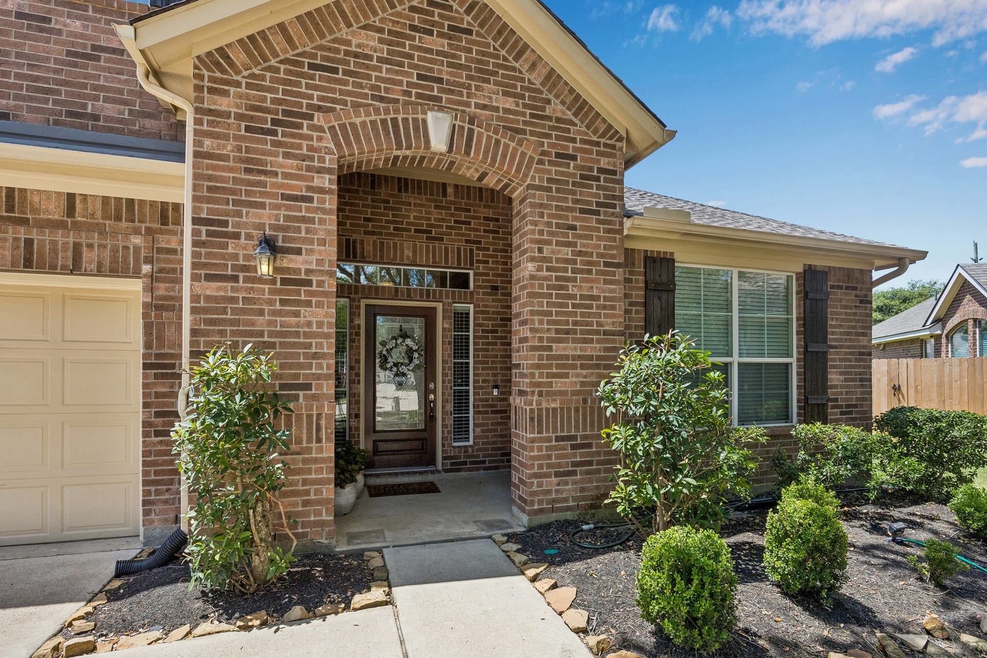 26251 Caper Meadow Lane, Katy, TX 77494 You will enter into the home through a beveled glass and wood front door. Surrounding the door are three transom windows to let natural light into the entry.