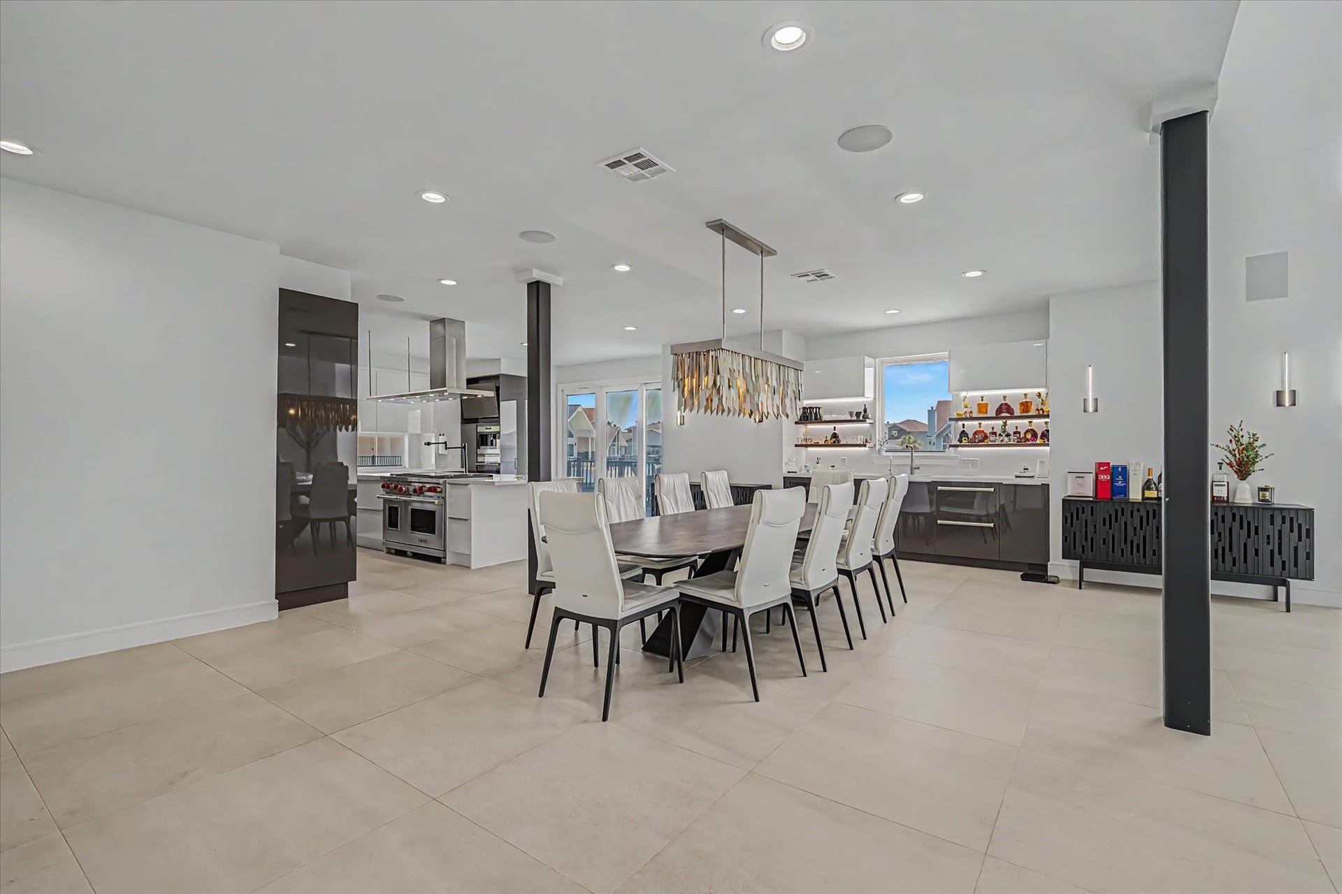 1047 & 1027 Long Reach Drive, Tiki Island, TX 77554 Open floorplan dining room connected with kitchen and living room