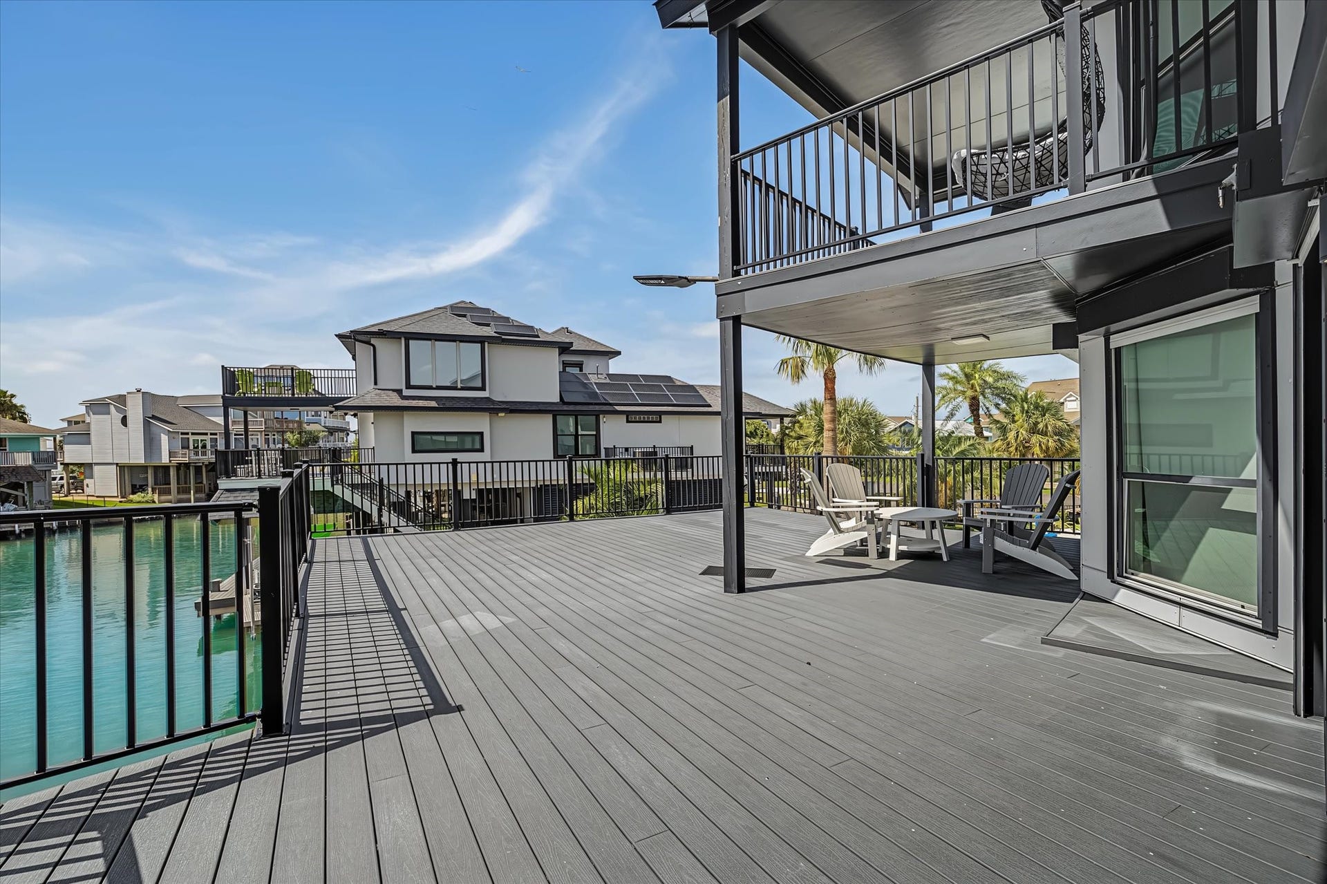 1047 & 1027 Long Reach Drive, Tiki Island, TX 77554 Upper level patio on Guest house