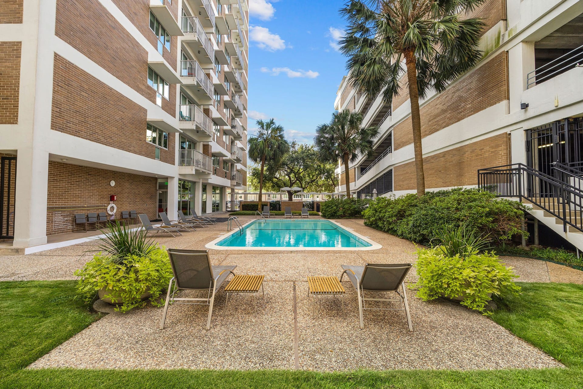 3600 Montrose Boulevard, #501, Houston, TX 77006 Enjoy a relaxing oasis with this inviting pool area, surrounded by lush greenery perfect for unwinding or socializing.