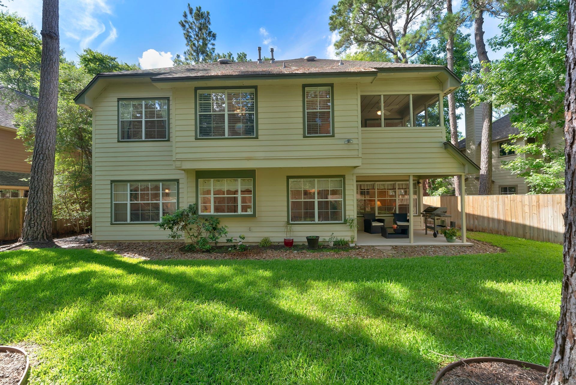 74 E Greywing Circle, The Woodlands, TX 77382 Here is a good view of the back of the home plus the covered patio and the yard............