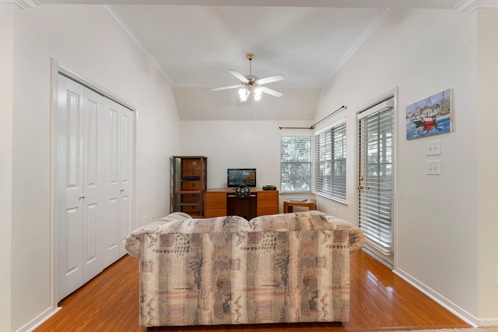 74 E Greywing Circle, The Woodlands, TX 77382 This is the upstairs gameroom----------the door to the right opens to the screened in porch.