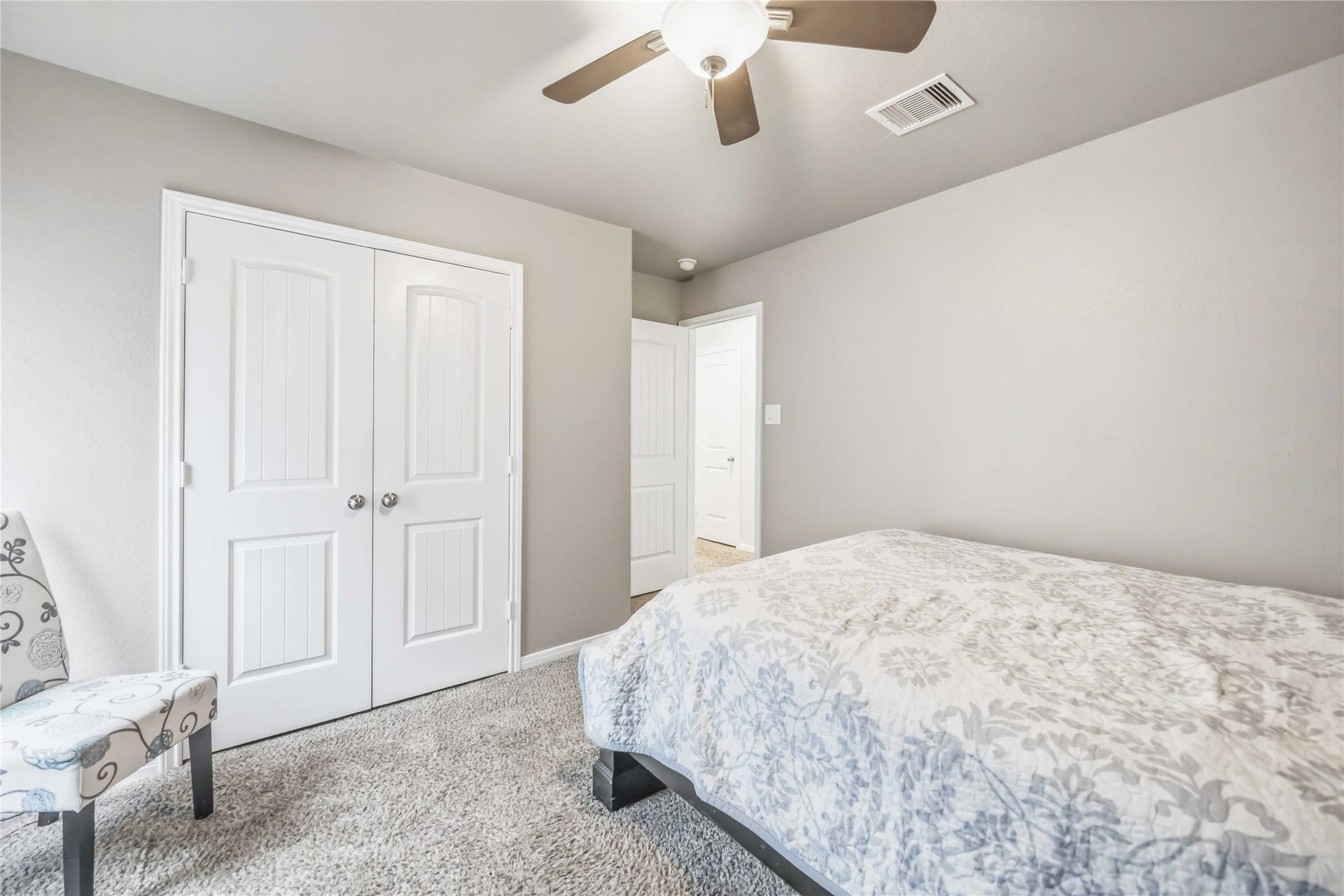 712 Rim Water Drive, Alvin, TX 77511 Cozy bedroom 1 featuring a plush carpet, soft neutral tones, and ample closet space.
