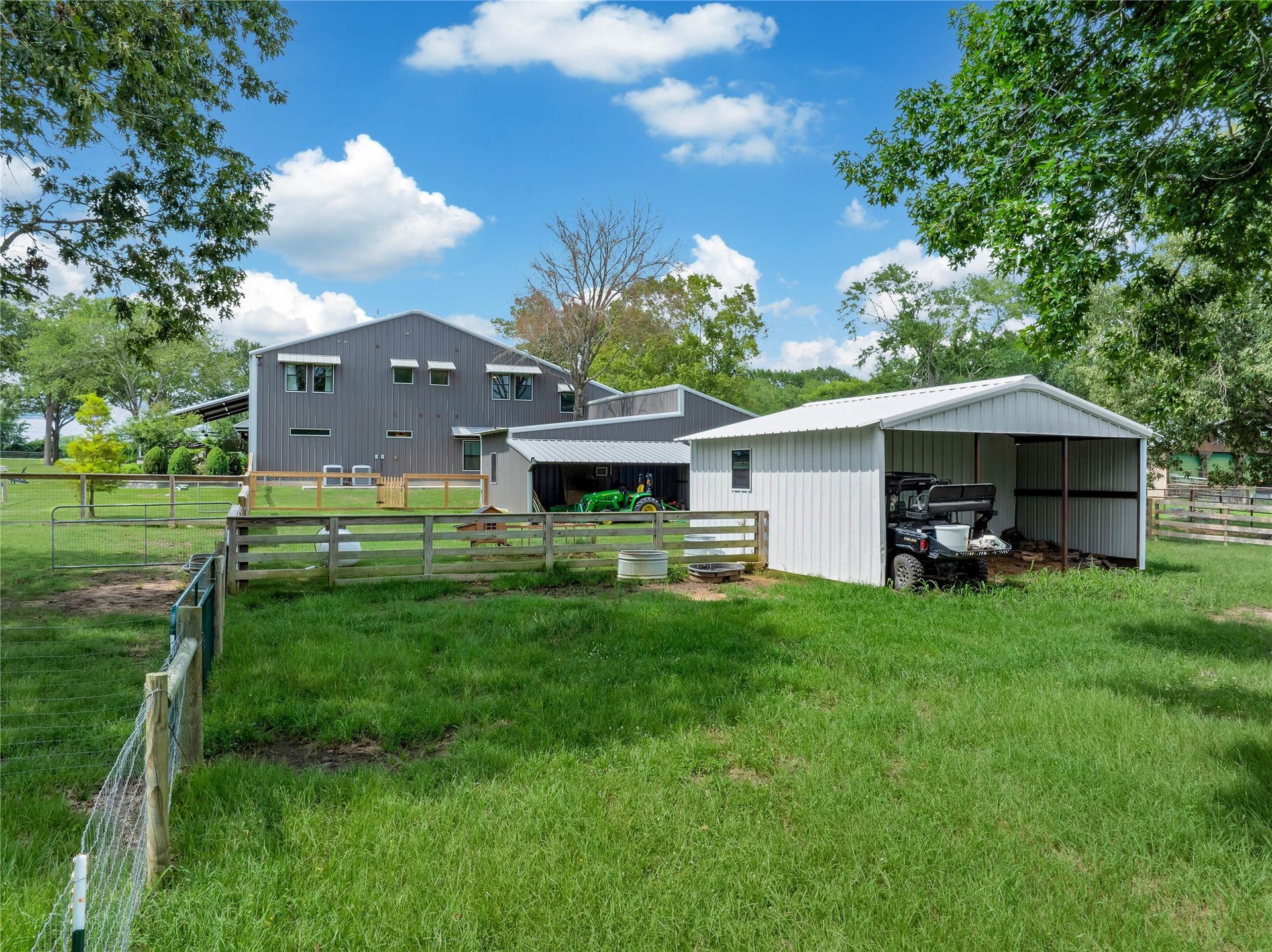 Two loafing shed/barn, one with 3 milking parlors. Three fully fenced pastures with water for rotational grazing.