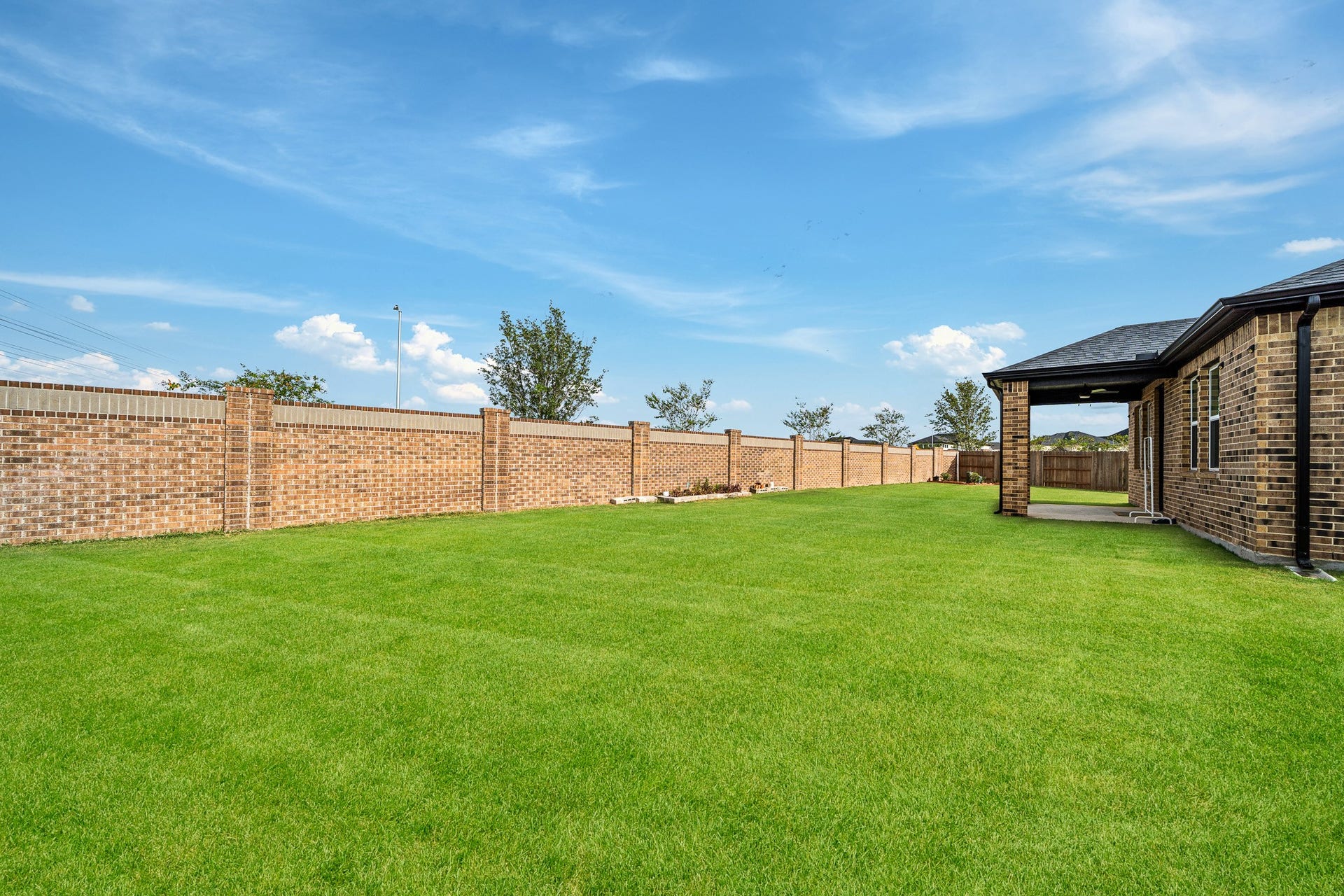 17602 Carnation Glen Drive, Richmond, TX 77407 Brick Fence in the back