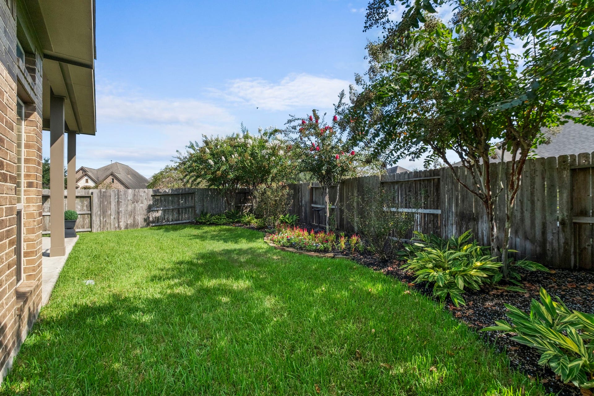 2030 Rainy Mist Drive, Missouri City, TX 77459 Fully fenced backyard offers a spacious lawn with plenty of room to enjoy the outdoors.