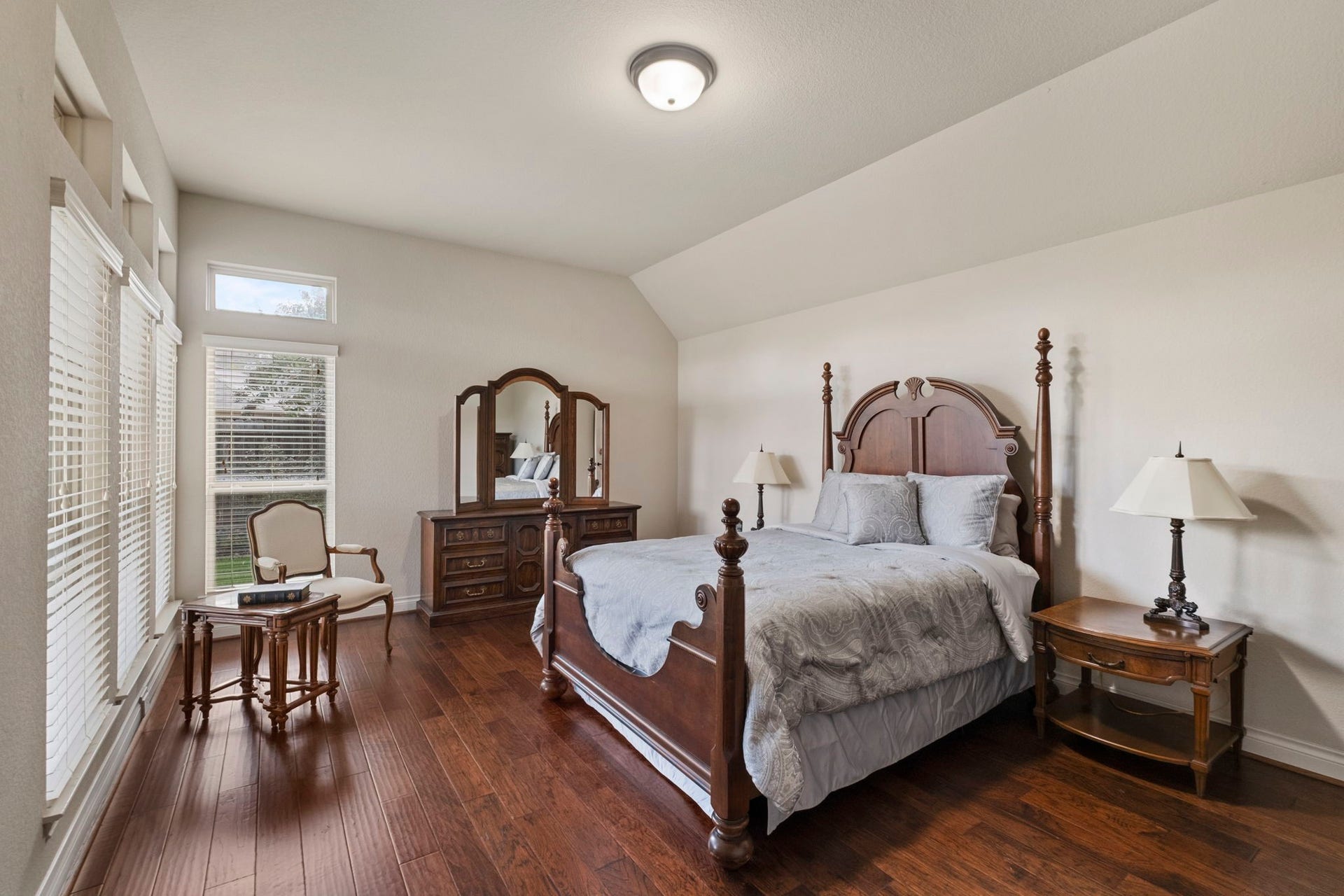2030 Rainy Mist Drive, Missouri City, TX 77459 Spacious primary retreat features wood flooring, high ceiling, and room for a sitting area.