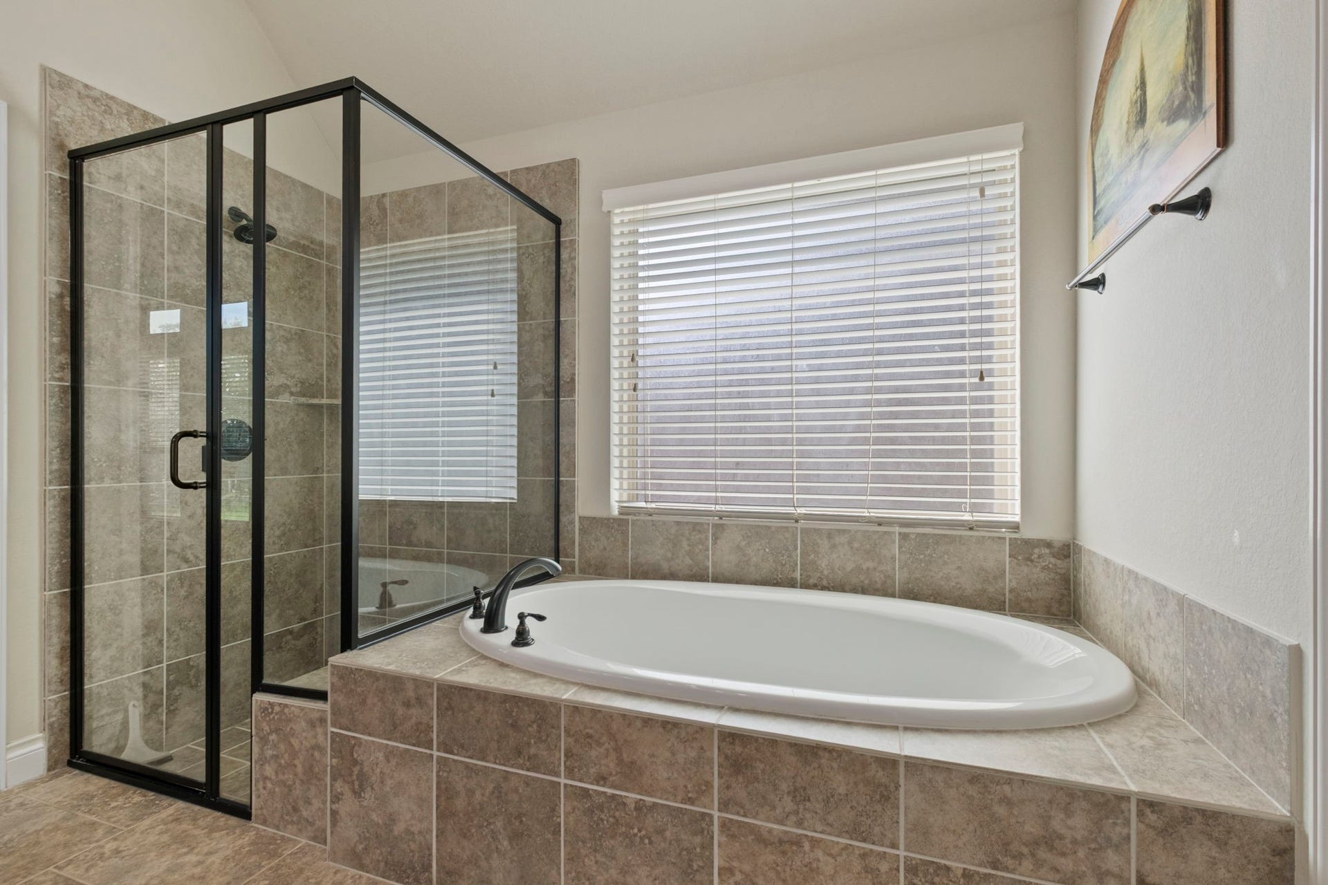 2030 Rainy Mist Drive, Missouri City, TX 77459 Relax in the oversized soaking tub surrounded by tile and natural light.