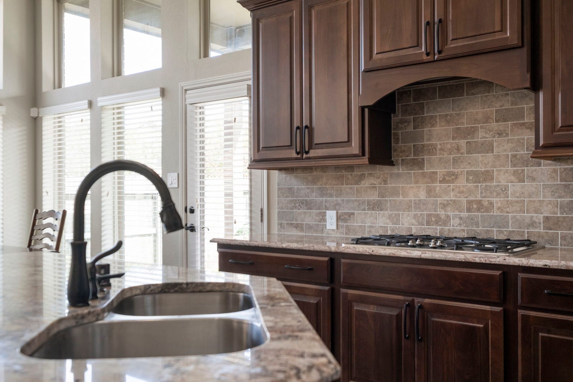 2030 Rainy Mist Drive, Missouri City, TX 77459 Large island with sink and seating creates a functional centerpiece for meal prep and casual dining.