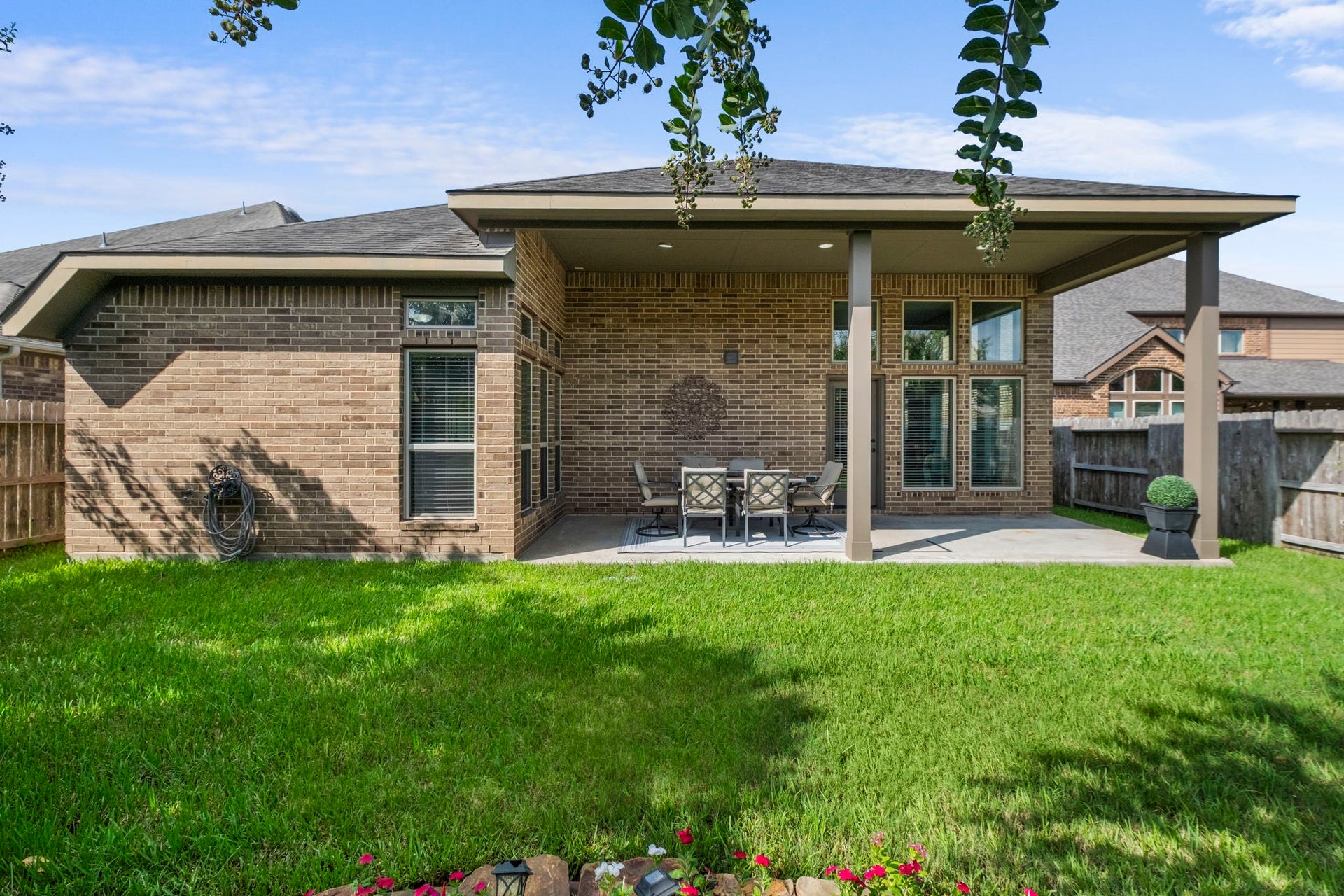 2030 Rainy Mist Drive, Missouri City, TX 77459 Covered back patio extends the living space outdoors and overlooks the grassy yard.