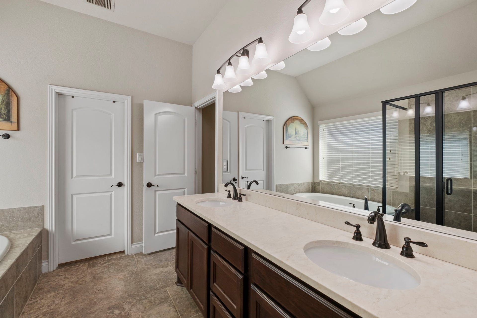 2030 Rainy Mist Drive, Missouri City, TX 77459 Spacious primary bath features separate vanities, excellent storage, and a layout designed for comfortable daily routines.