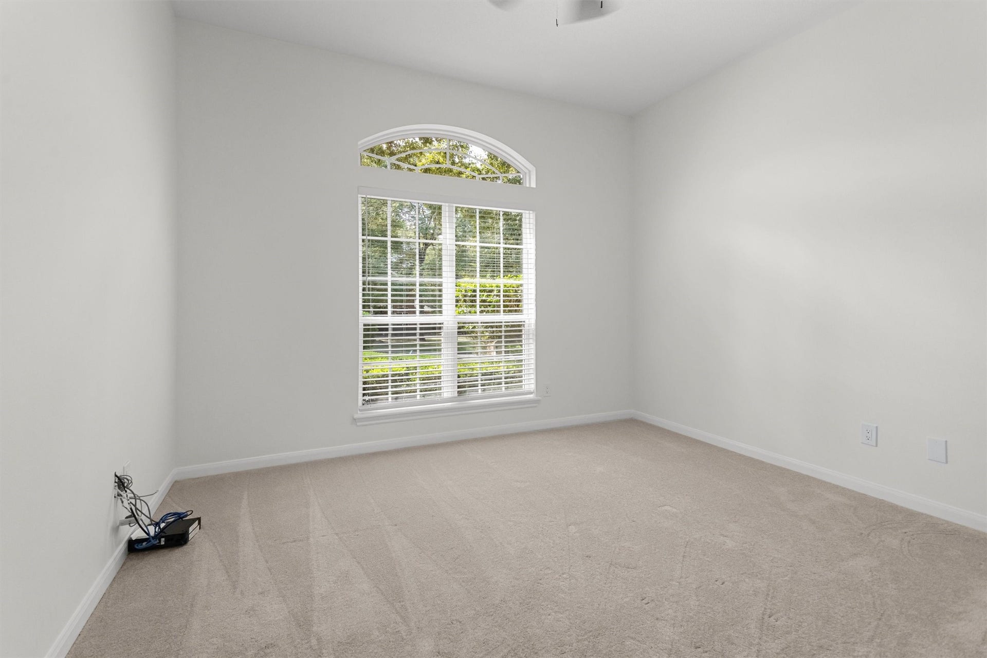 13 Royal Dalton Circle, Conroe, TX 77304 This home features a desirable split floor plan. The primary bedroom and a flexible roomperfect for use as a study or a fourth bedroomare situated on one side of the house, while two additional bedrooms and a full bathroom are located on the opposite side for added privacy.