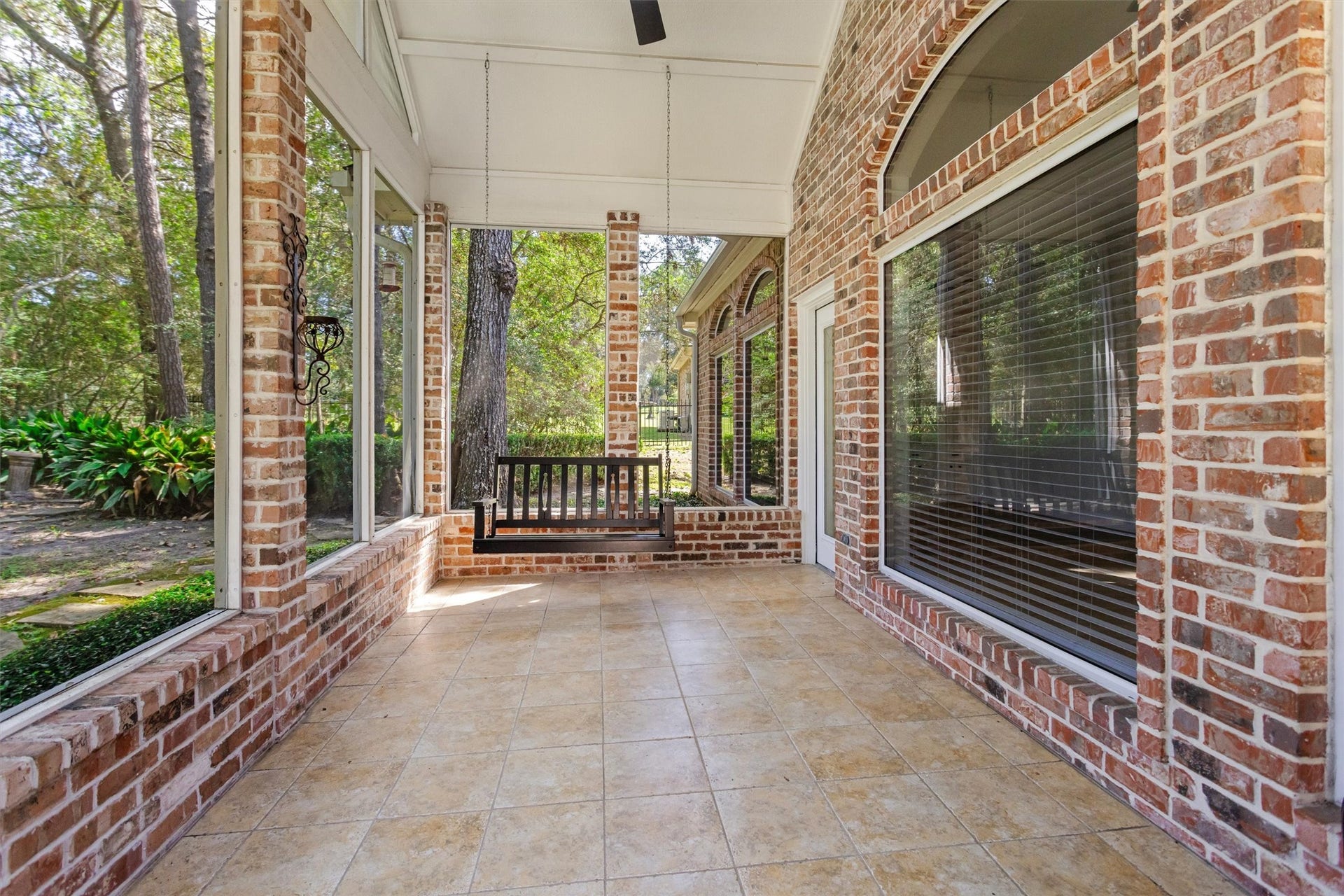 13 Royal Dalton Circle, Conroe, TX 77304 This sunroom swing is the perfect spot to enjoy crisp fall mornings with a cup of coffee or to unwind with a glass of wine during a warm Indian summer evening.