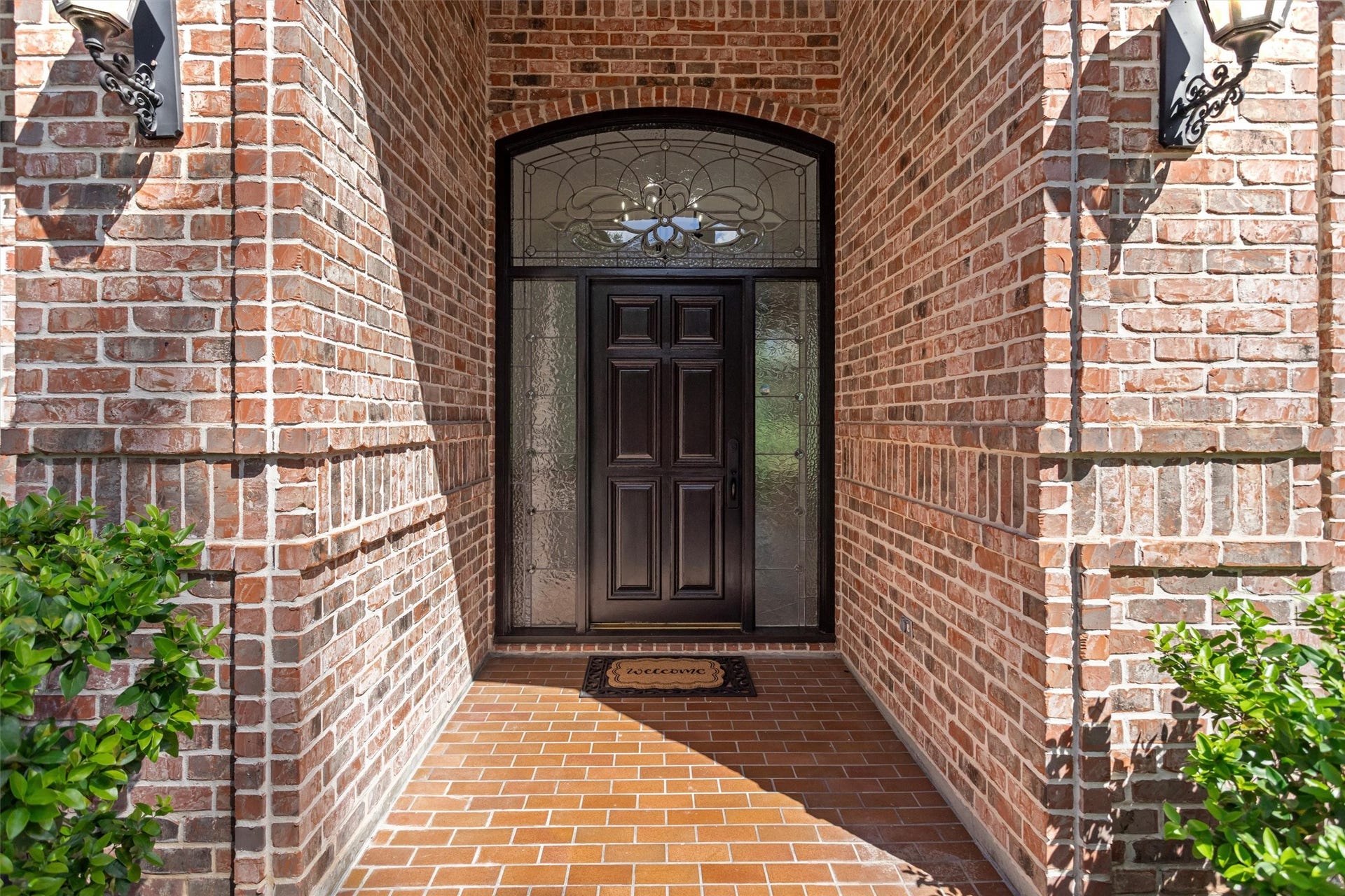 13 Royal Dalton Circle, Conroe, TX 77304 Timeless elegance and architectural details set this home apart from today's new construction, beginning with the stunning entry door framed by intricate leaded and beveled glass.