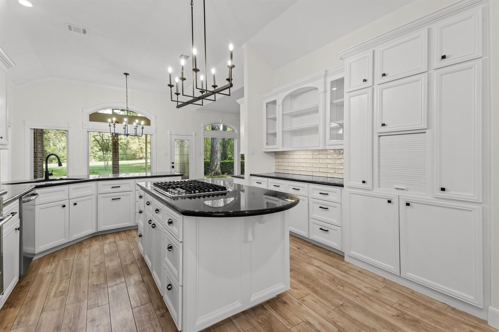 13 Royal Dalton Circle, Conroe, TX 77304 The updated kitchen features new fixtures, flooring, paint, and a new oven and stove. It offers ample storage space for all your cookware and provides a lovely view of the backyard to enjoy while you cook.