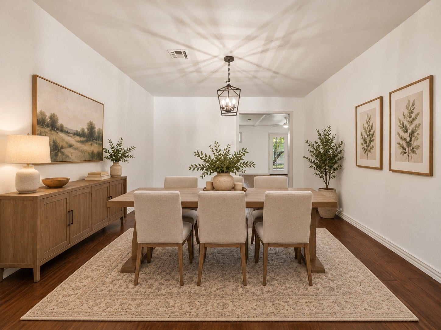 Ditigally Staged. The formal dining room opens to both the formal living and family rooms, providing a comfortable flow for entertaining and gatherings with family and friends.