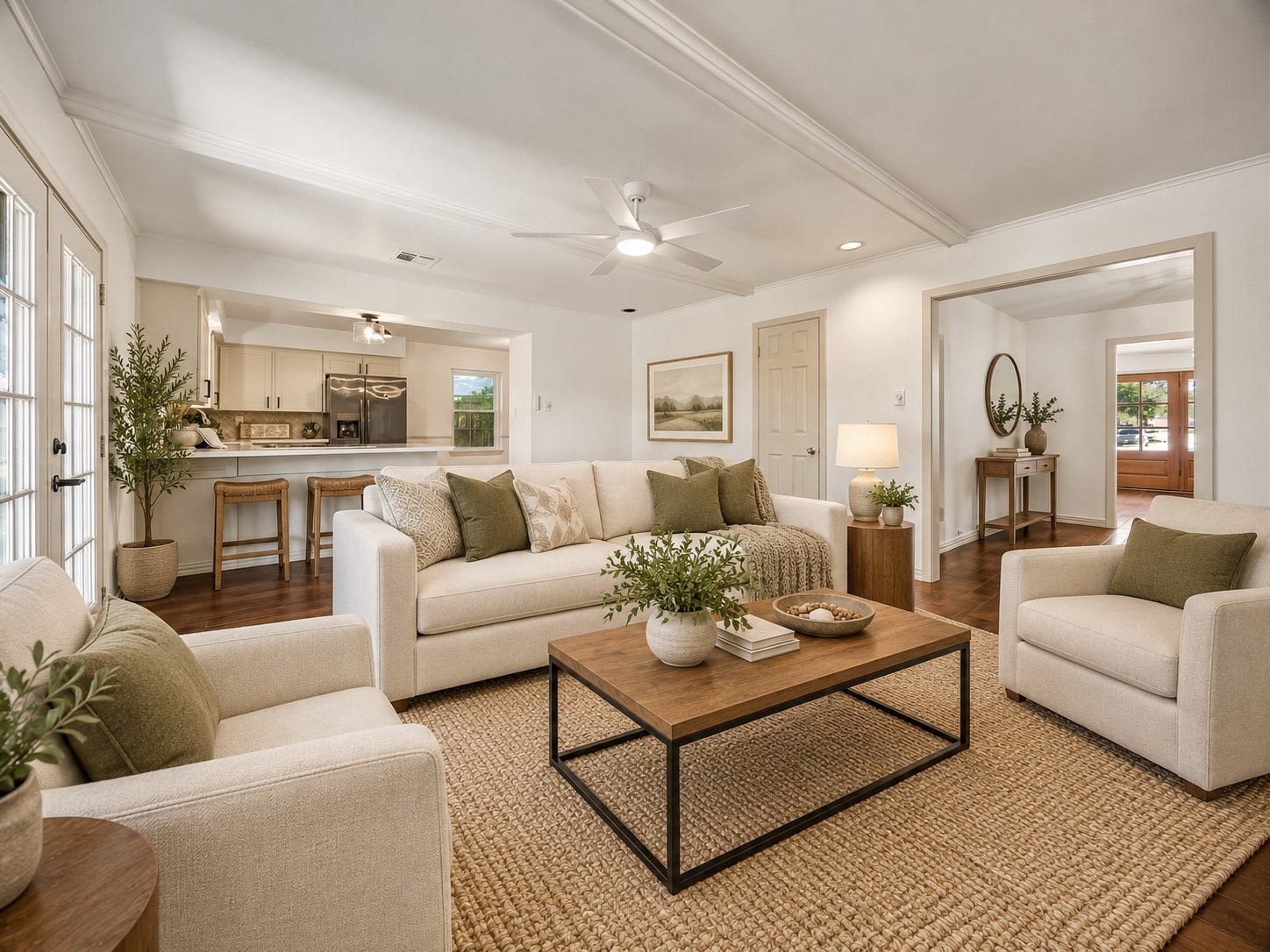 Ditigally Staged.  Designed for casual living, the family room features a convenient breakfast bar connecting to the kitchen and double doors opening to the covered patio, bringing the outdoors within easy reach.
