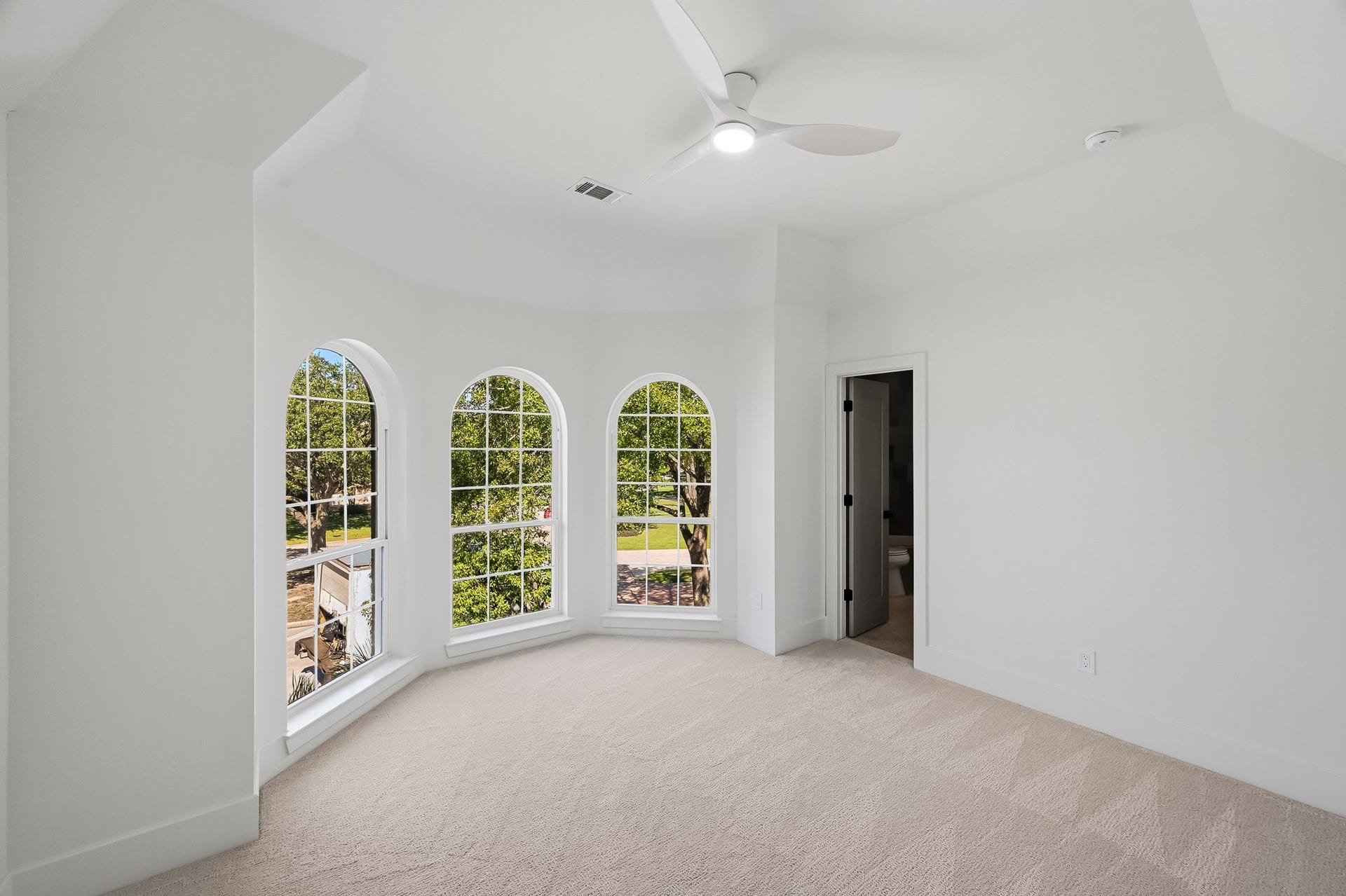 The third guest suite overlooks the front lawn and has a huge walk-in closet!
