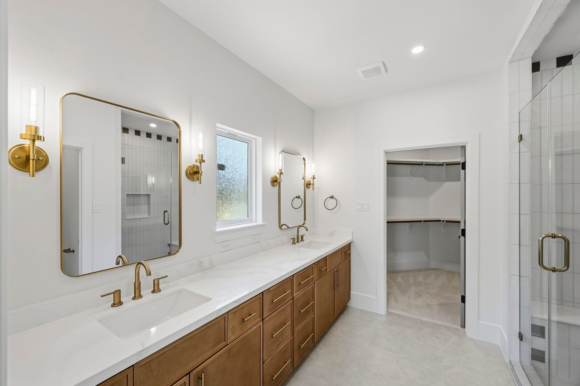 The ensuite bath is set up as a 2nd master suite!