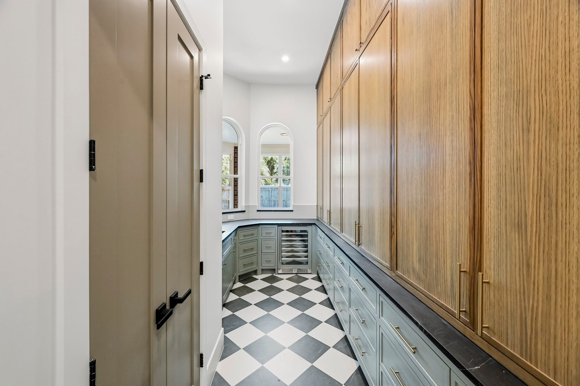 Behind the kitchen is an incredible scullery + food pantry!