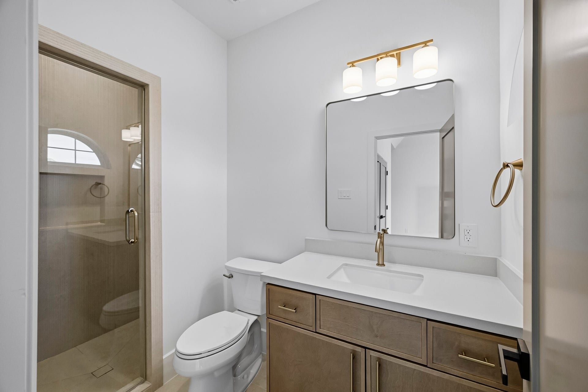 The private ensuite enjoys a walk-in shower!