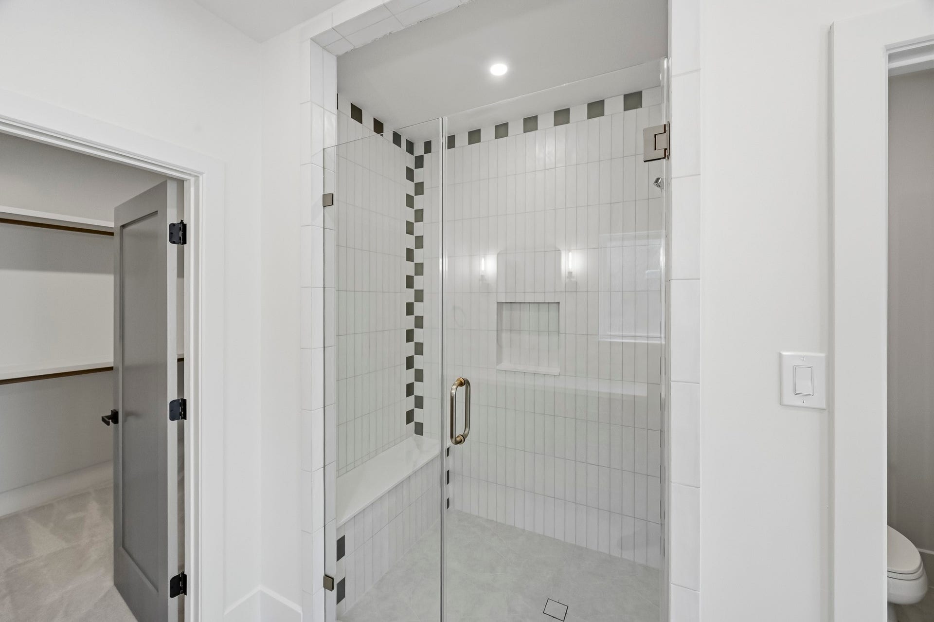 It boasts a walk-in shower, water closet, double vanities, and a spacious walk-in closet!