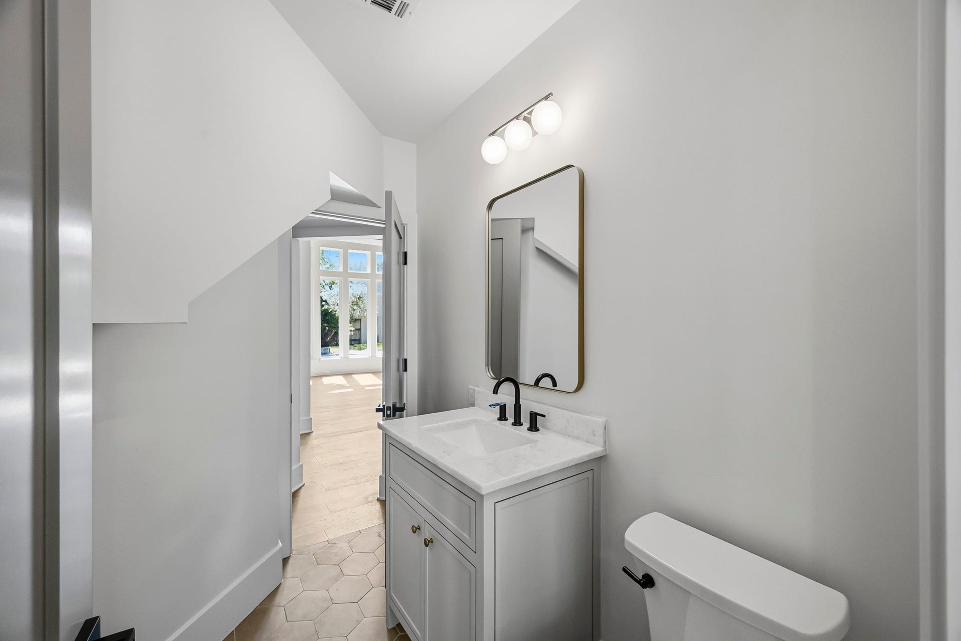 The downstairs guest full bath provides tons of flexibility!