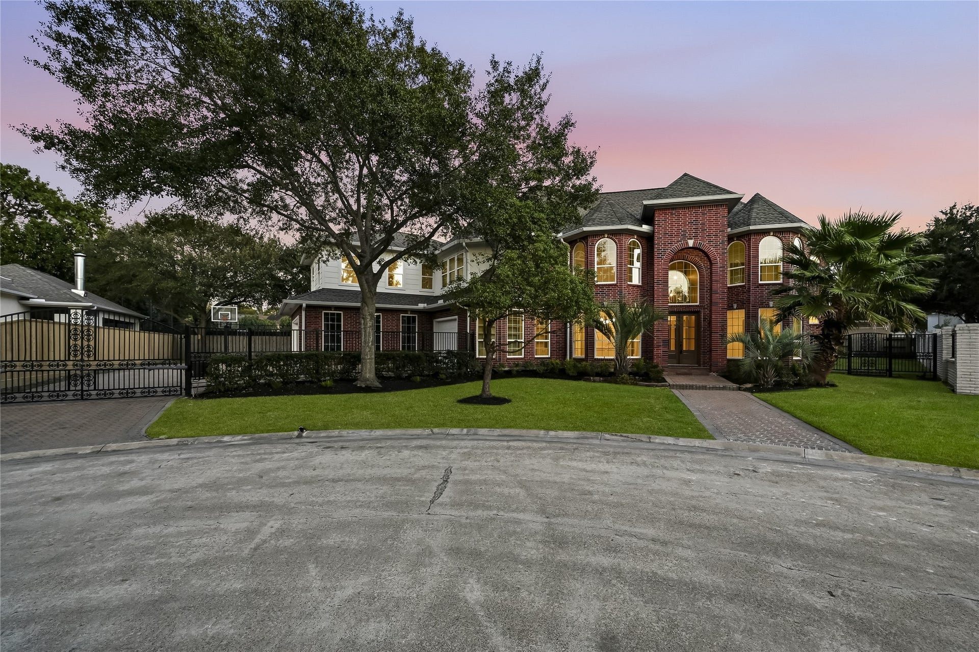 Stately brick home with mature trees and landscaping!