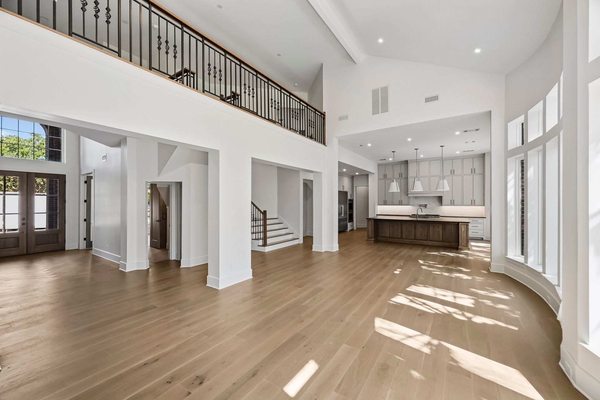 Soaring ceilings and a sky-bridge connecting the upstairs!
