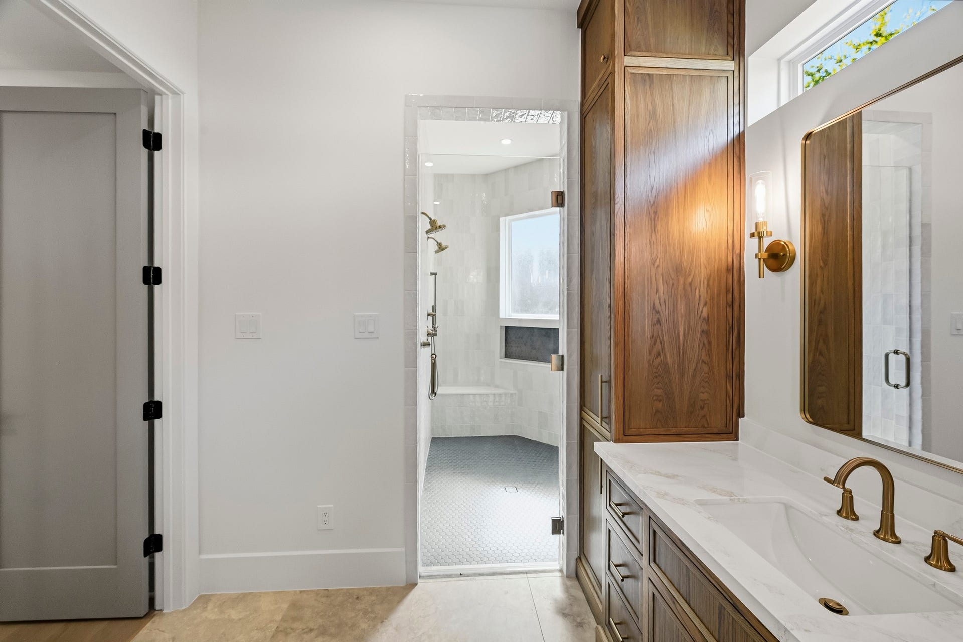 Massive walk-in shower with window and bench!
